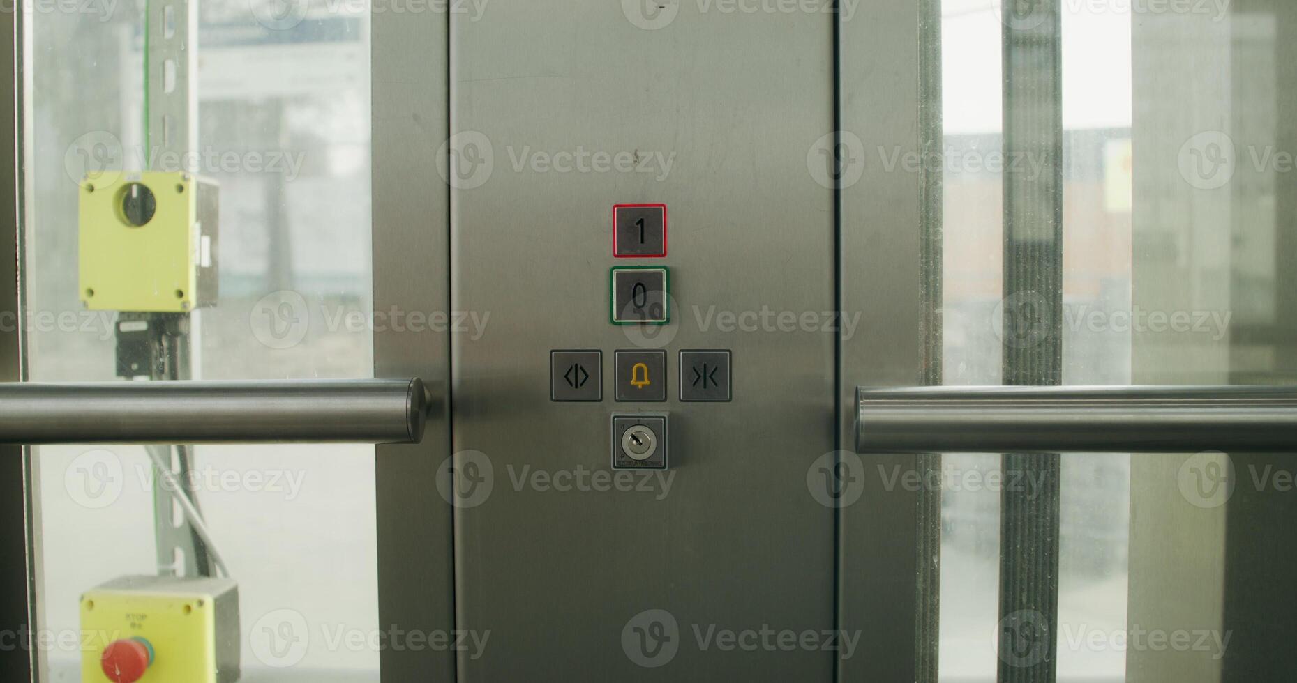 A woman presses the floor selection button in an elevator, close-up of her hand, an unrecognizable person photo