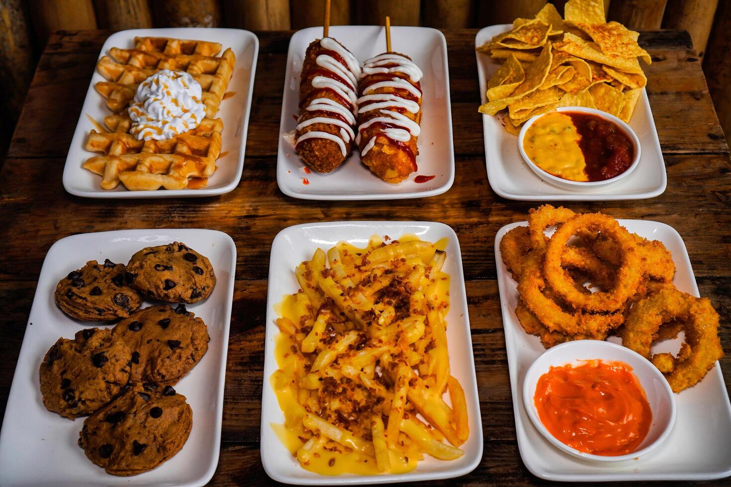 waffles, corn dog, nachos, cookies, loaded fries, onion rings photo