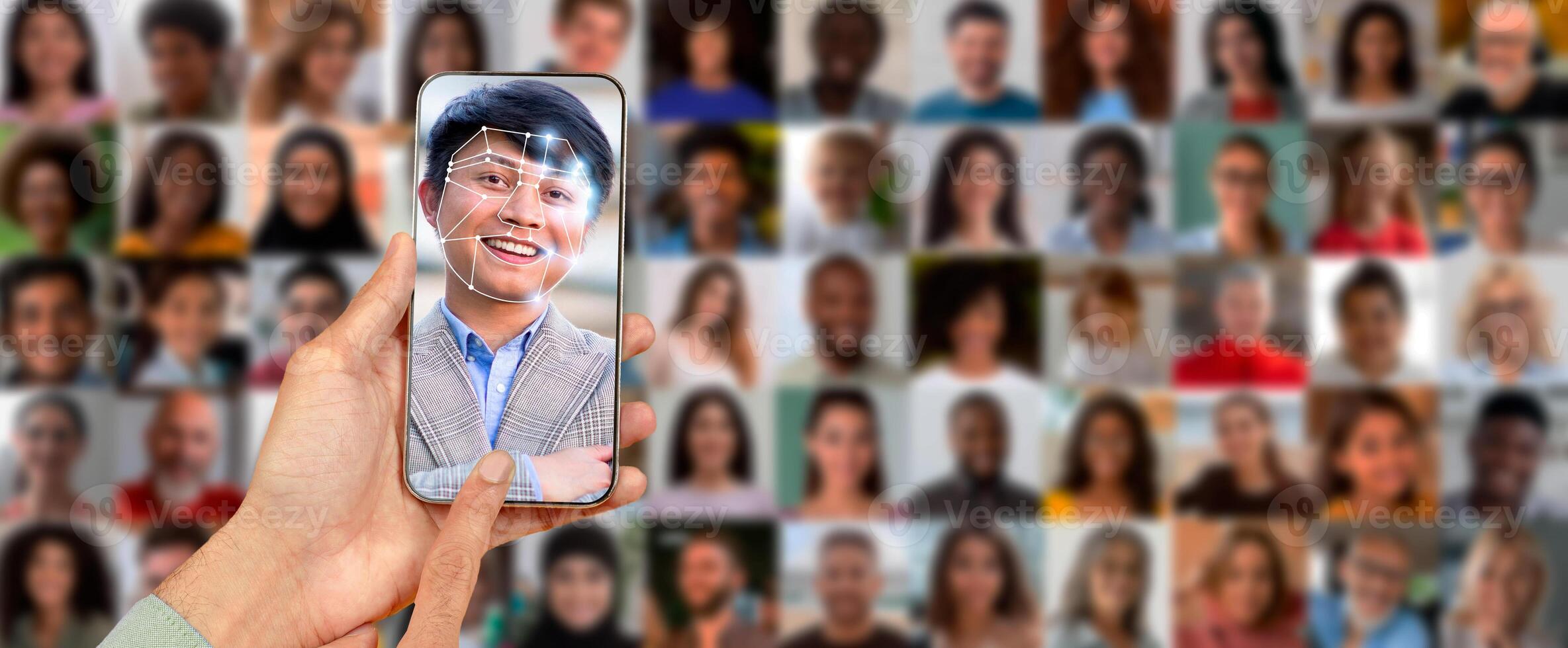 A person holds a smartphone displaying a facial recognition scan. photo
