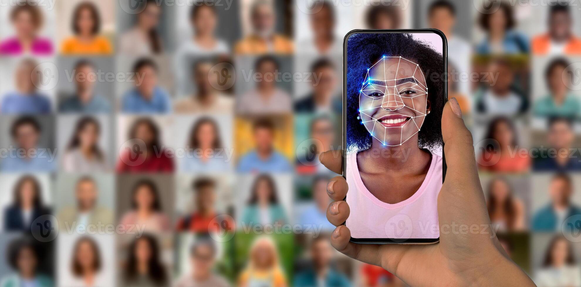 A smartphone is held in hand, showcasing a facial recognition scan of a smiling person. The background features a collage of diverse faces. This highlights the advanced technology in modern devices. photo