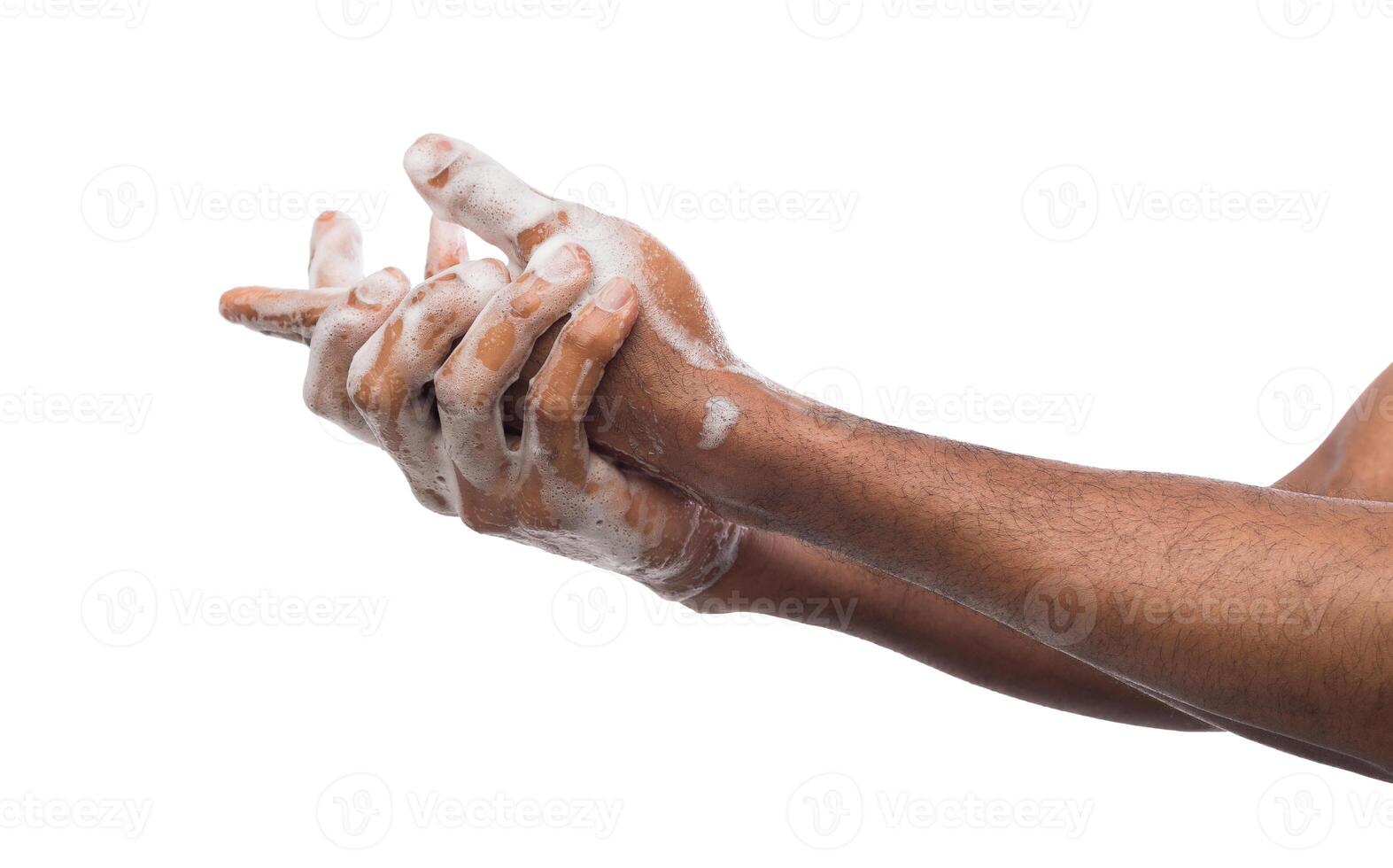 Black man washing hands with soap isolated on white background. Hygiene, cleanliness concept photo