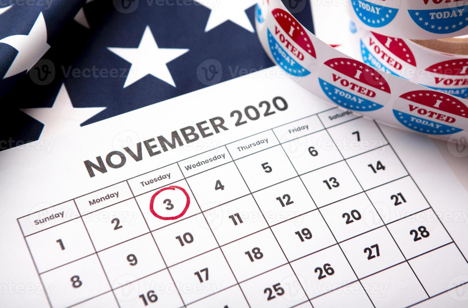 November 2020 presidential election date on calendar concept. Red white and blue colors and the american flag. photo