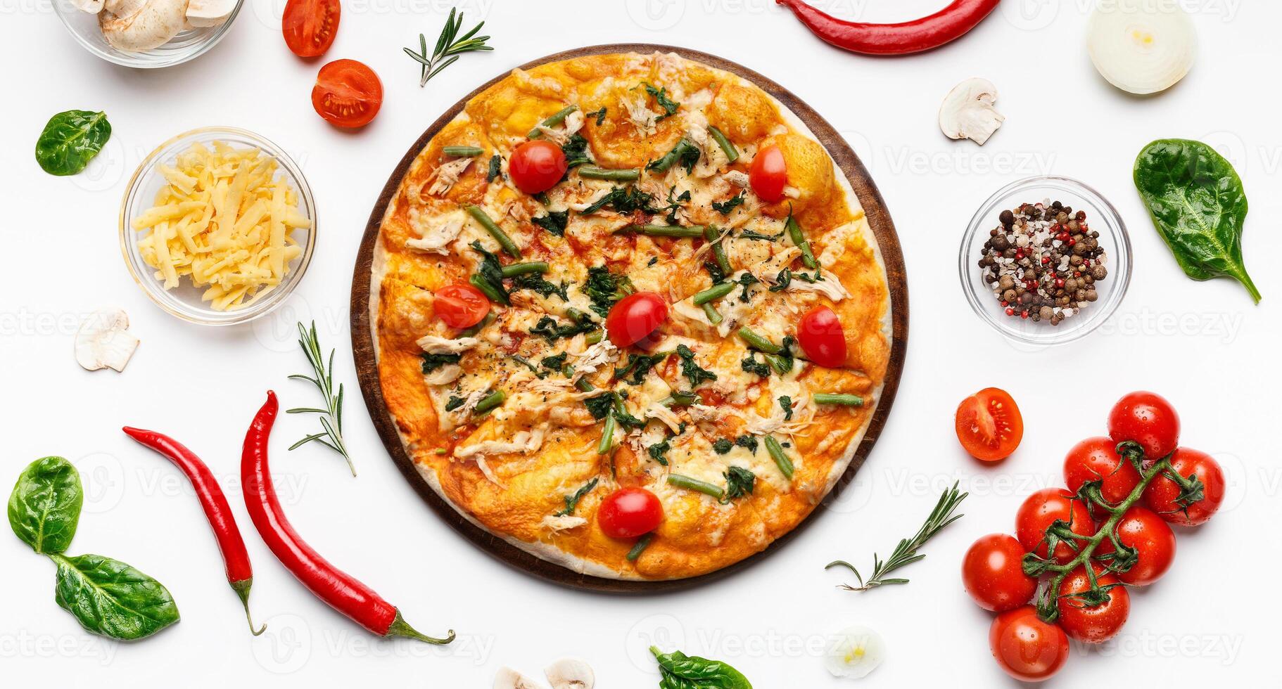 Delicious italian pizza with cheese and cherry tomatoes on white table with ingredients around, top view photo
