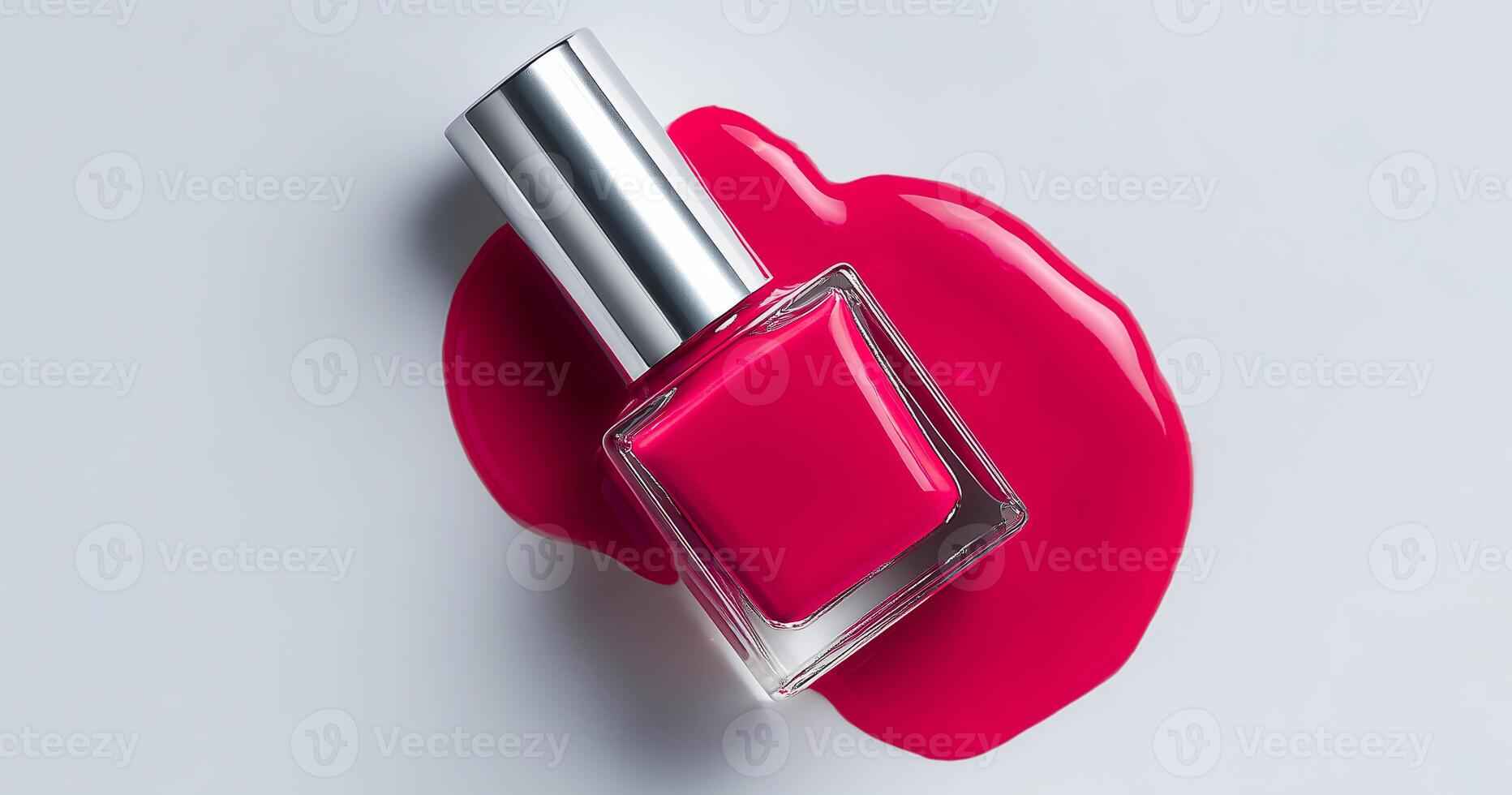 Expert nail artist applies a luxurious pink gel polish to enhance the look of manicured nails. The colorful polish is presented beside a spilled puddle, showcasing its rich texture and shine. photo