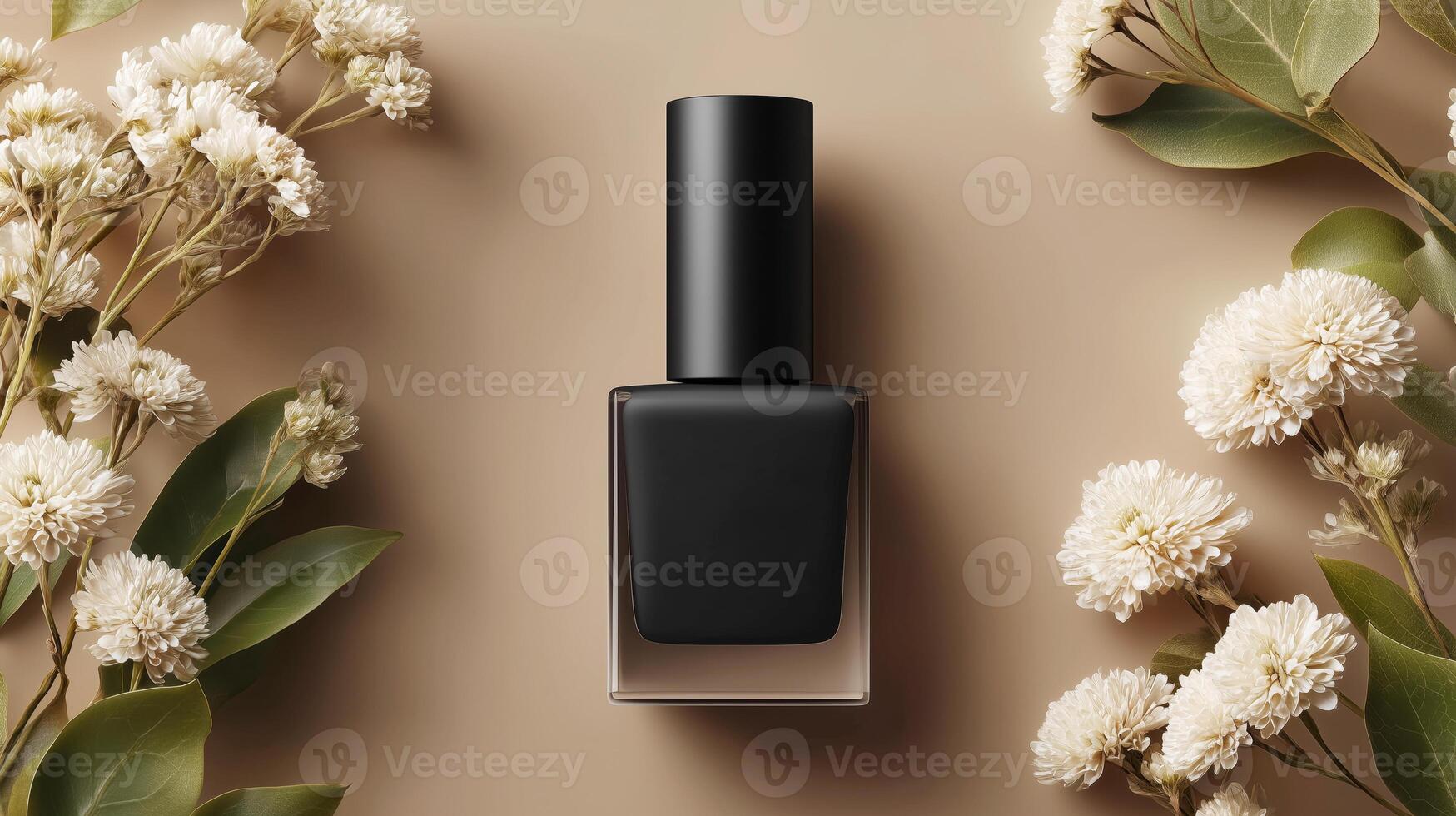 A bottle of black gel nail polish sits on a soft beige surface surrounded by delicate flowers and leaves. The setup captures the essence of luxury and sophistication in nail care. photo