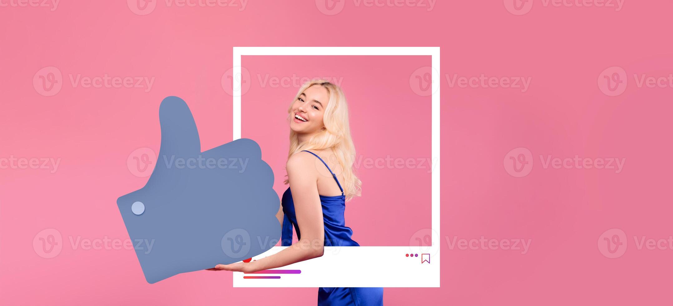 A confident influencer poses with a thumbs up gesture against a vibrant pink background. She wears a stylish blue outfit, radiating positivity and connection typical of online content creators. photo