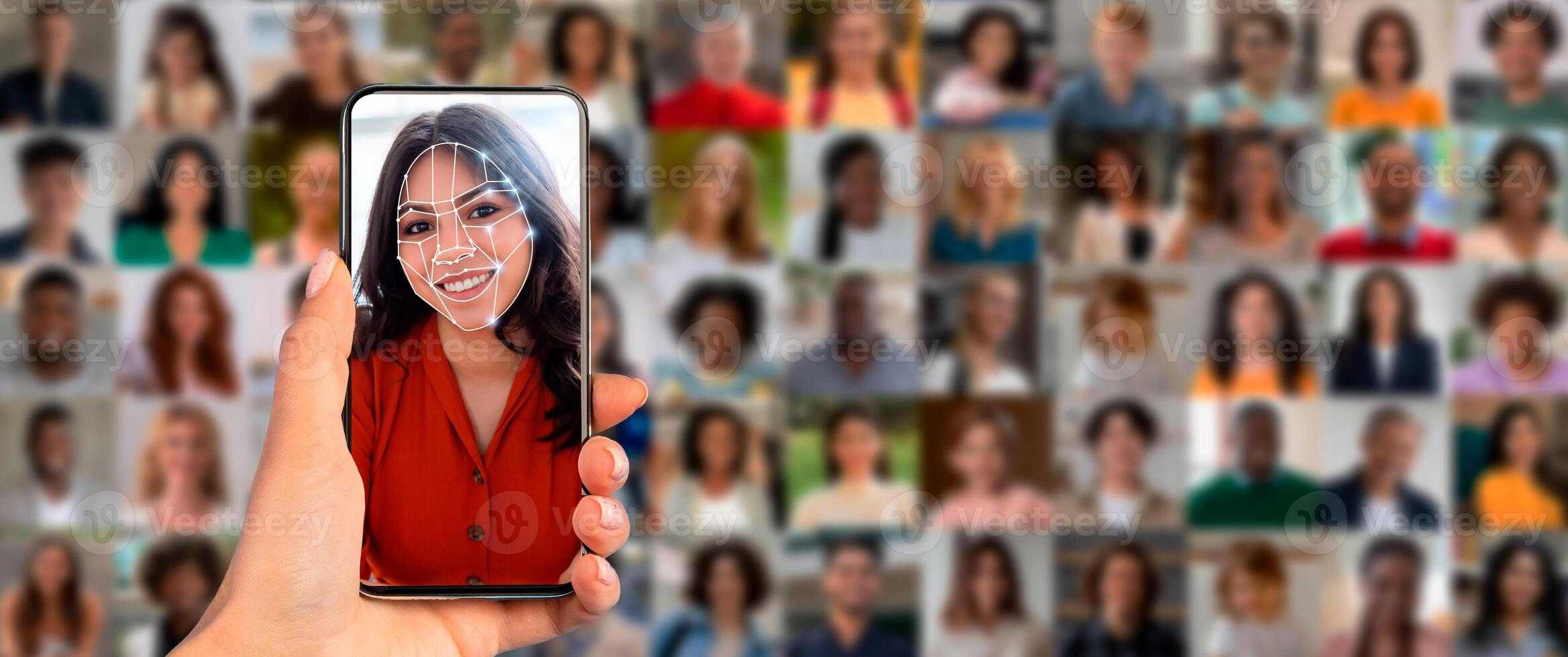 A person holds a smartphone up to their face, activating facial recognition technology. Behind them is a collage of diverse faces, showcasing modern identification methods in action. photo
