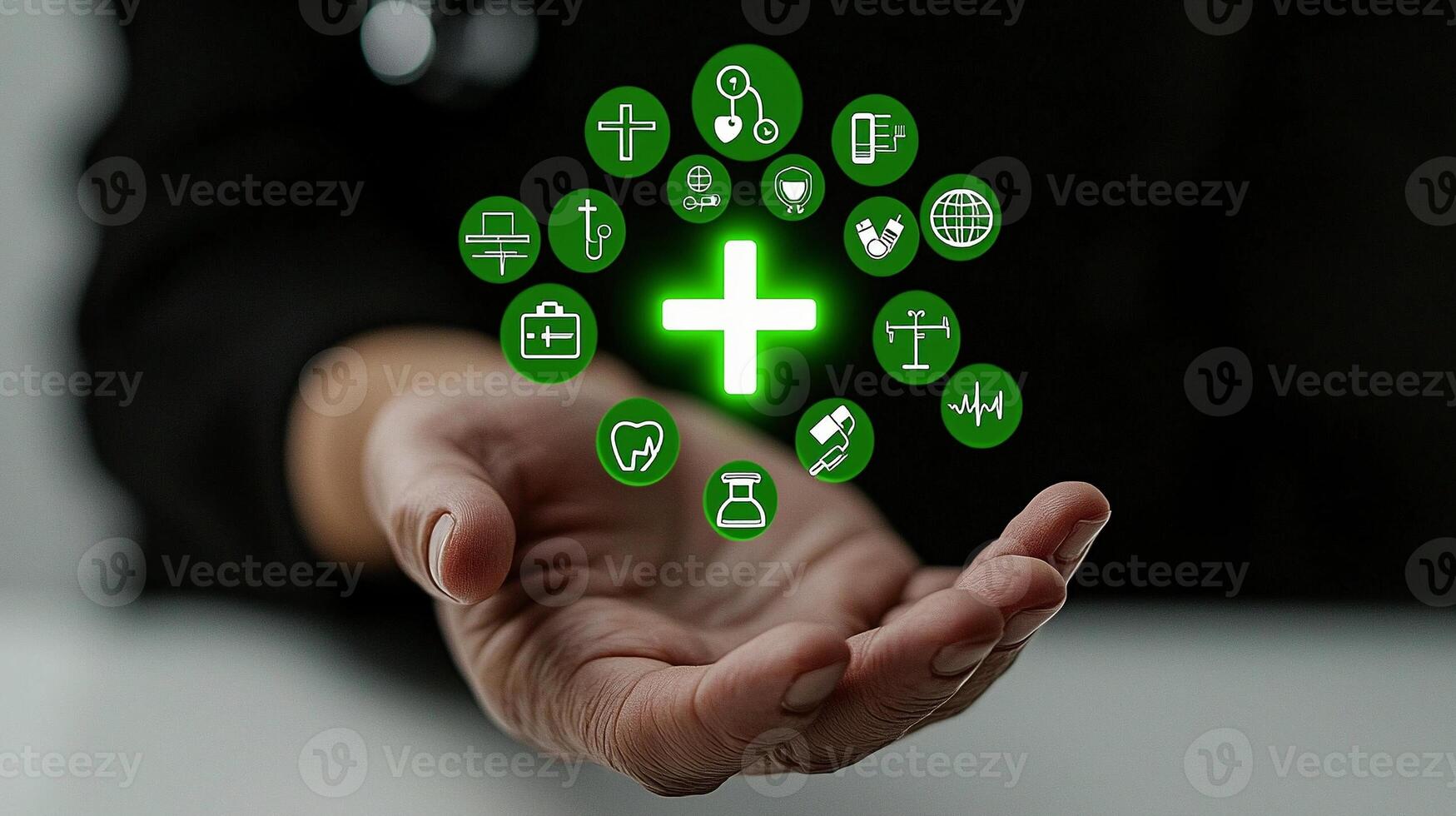 A hand displaying glowing health-related icons symbolizing medical care and wellness photo