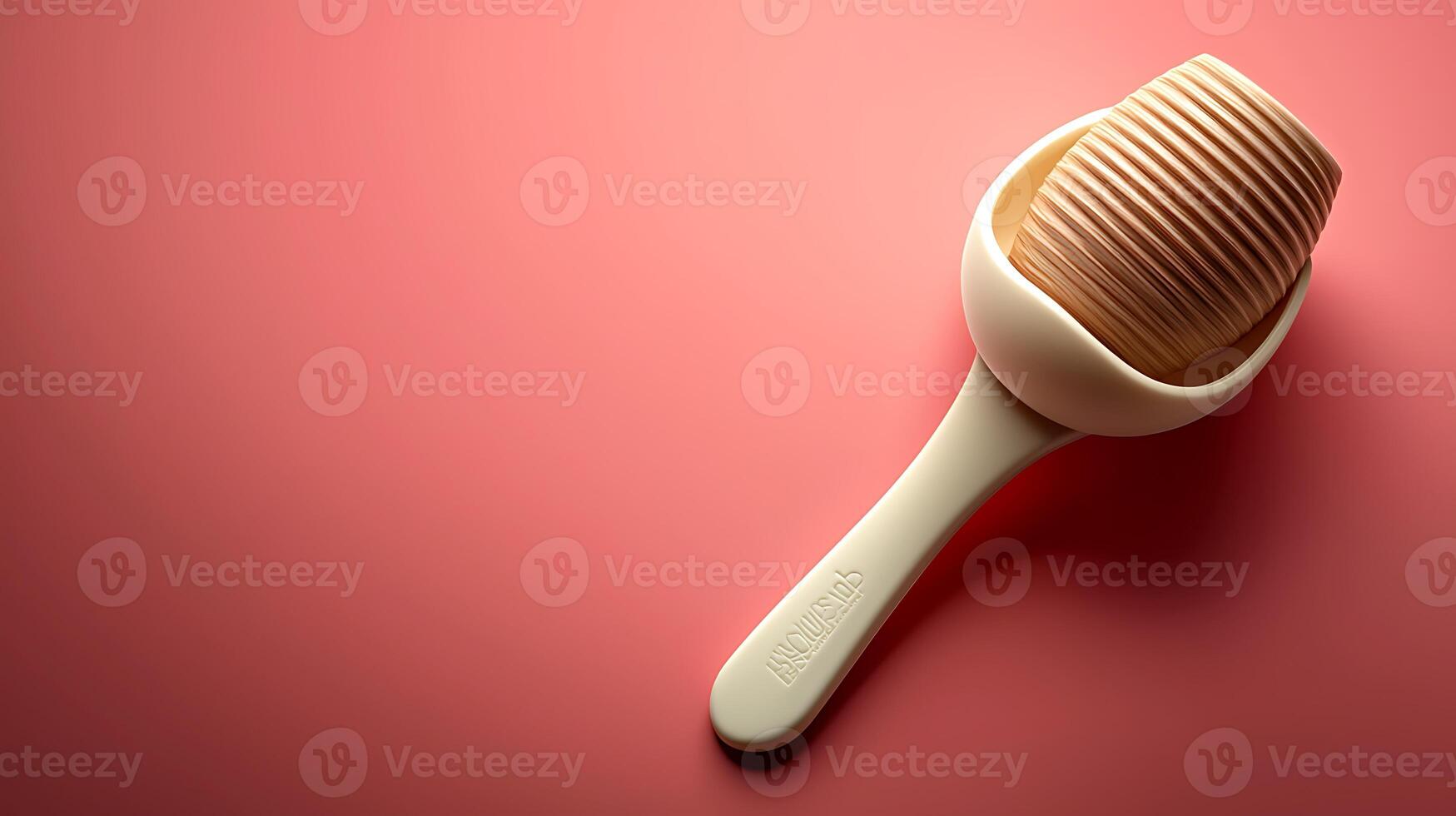 A minimalist kitchen utensil resting on a soft pink surface, showcasing modern design aesthetics photo