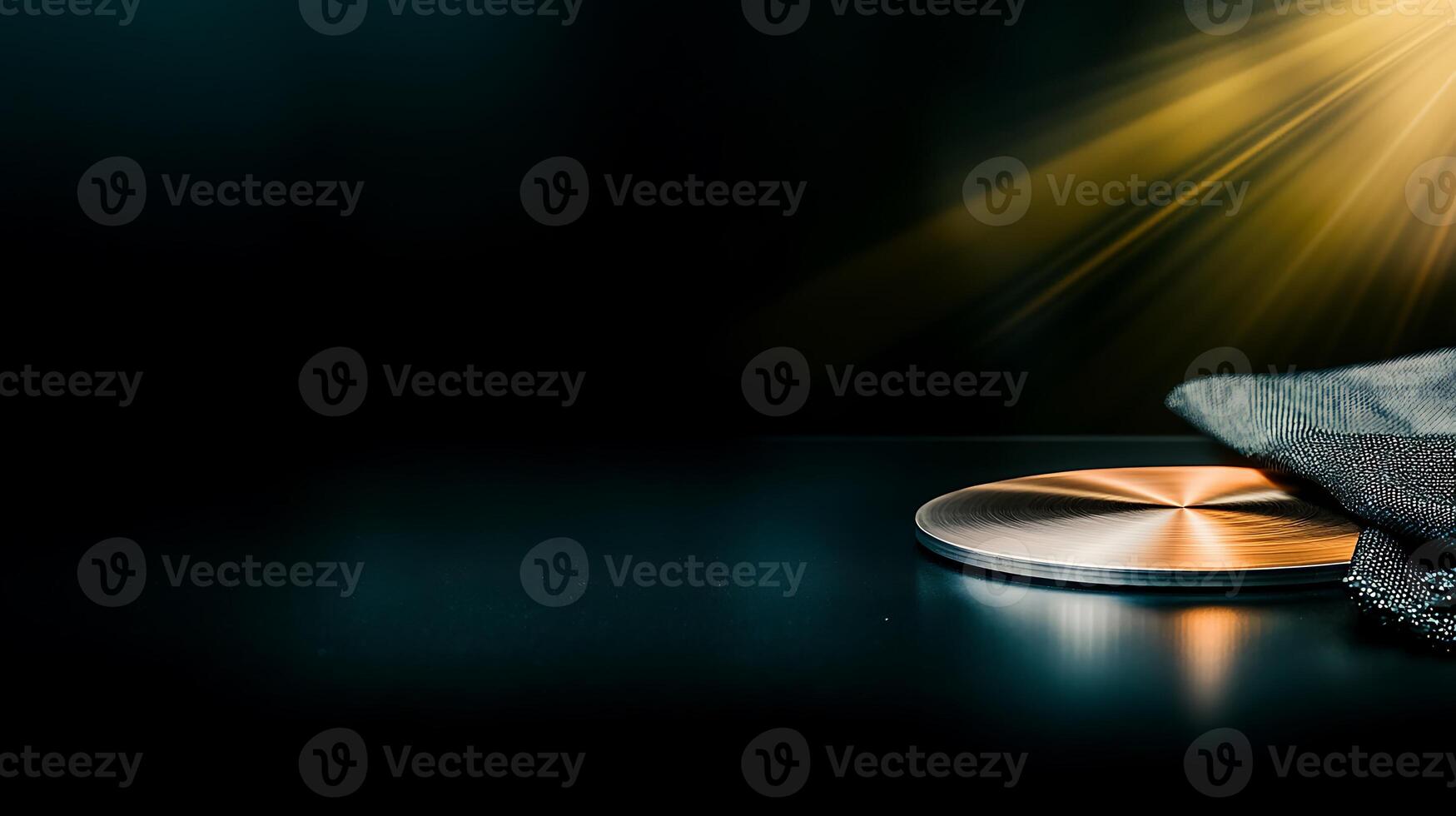A polished metallic surface with a soft cloth, illuminated by dramatic lighting effects photo