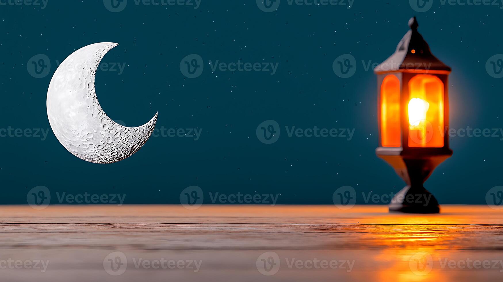 A serene night scene featuring a crescent moon and a glowing lantern on a wooden surface photo