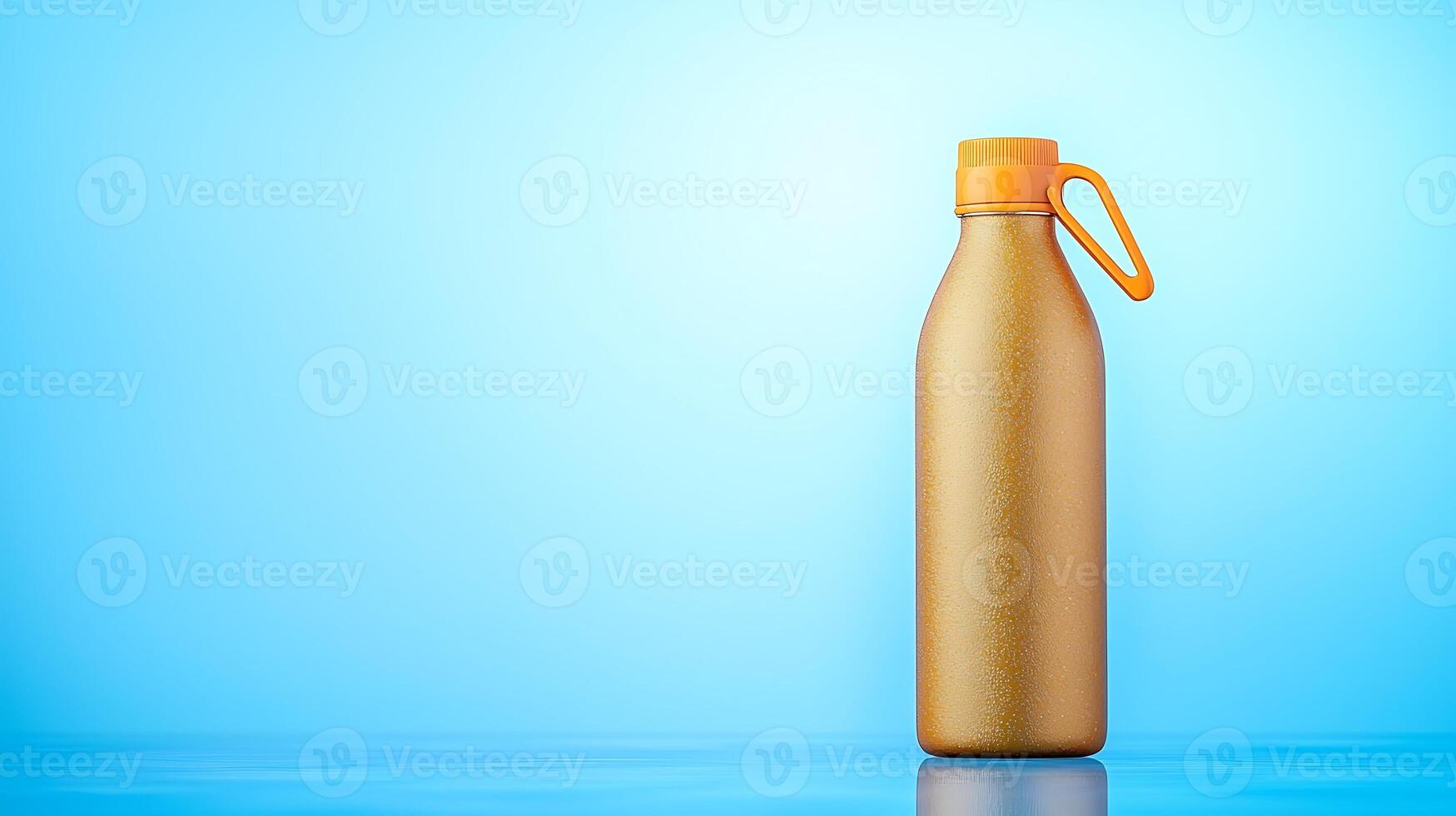 A shiny gold water bottle with an orange cap against a soft blue background, ideal for product displays photo