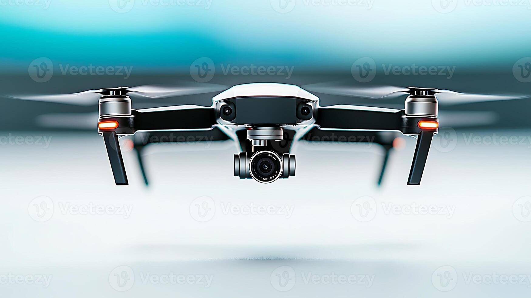 A sleek drone hovering in mid-air, showcasing advanced technology against a blurred background photo