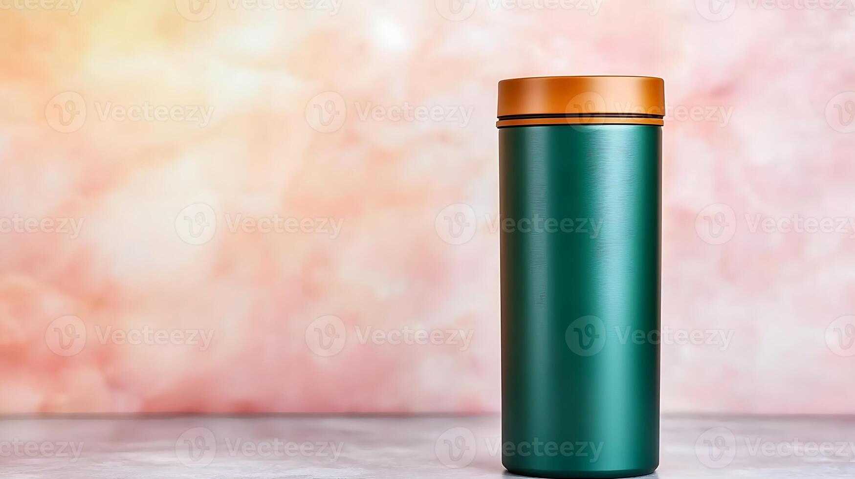 A sleek green thermos with a copper lid standing against a soft pink marble background photo