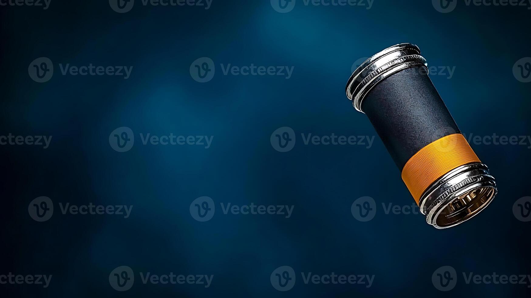 A sleek, modern cylindrical object with a black and orange band floating against a blue background photo