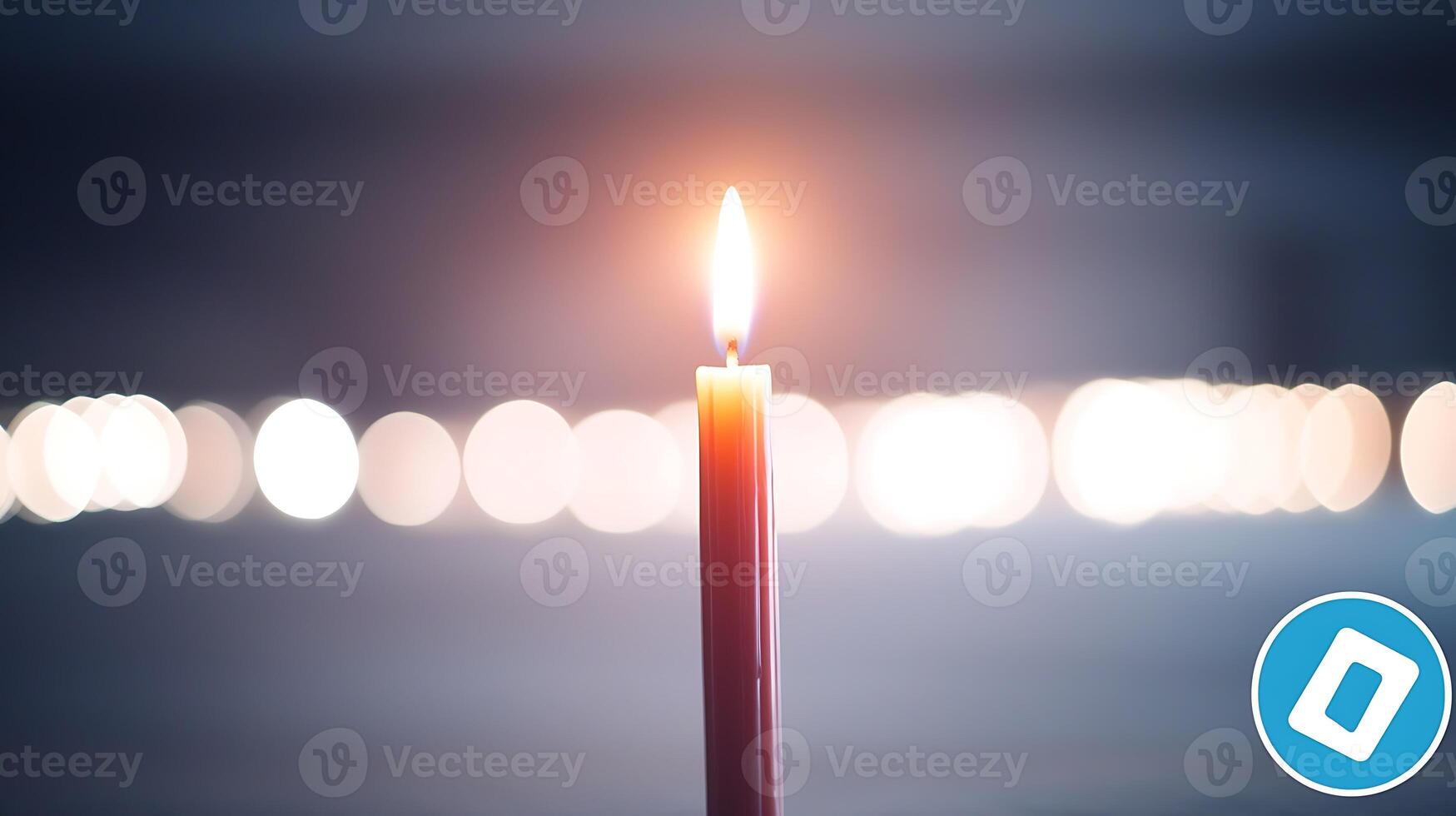 A solitary candle flame illuminates a dimly lit background with blurred lights, creating a serene ambiance photo