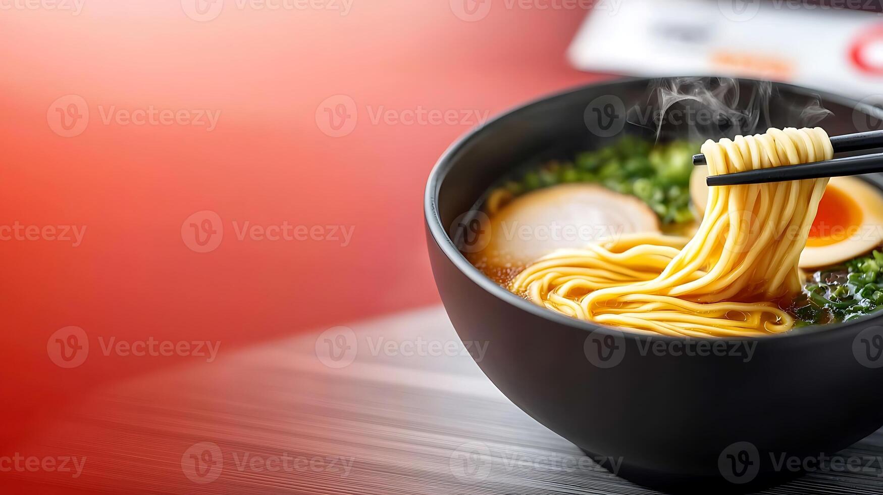 A steaming bowl of ramen with soft-boiled egg and sliced pork, served in a cozy restaurant setting photo
