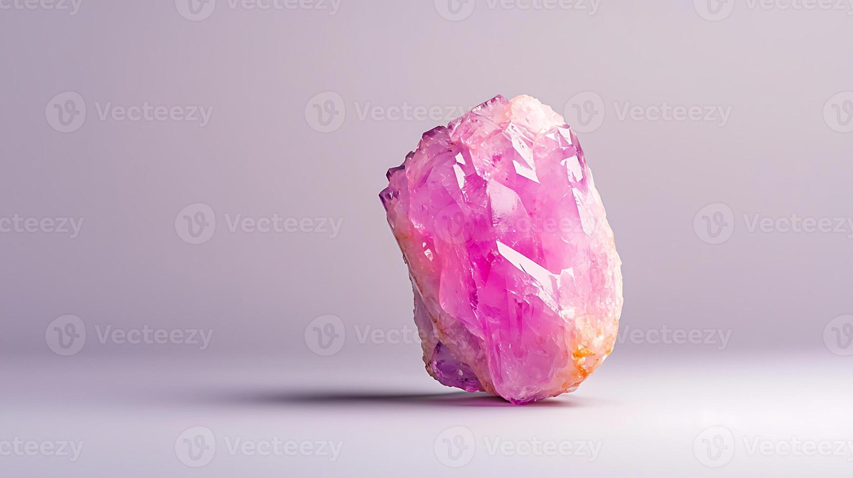 A stunning pink crystal rock positioned elegantly against a soft, neutral background photo