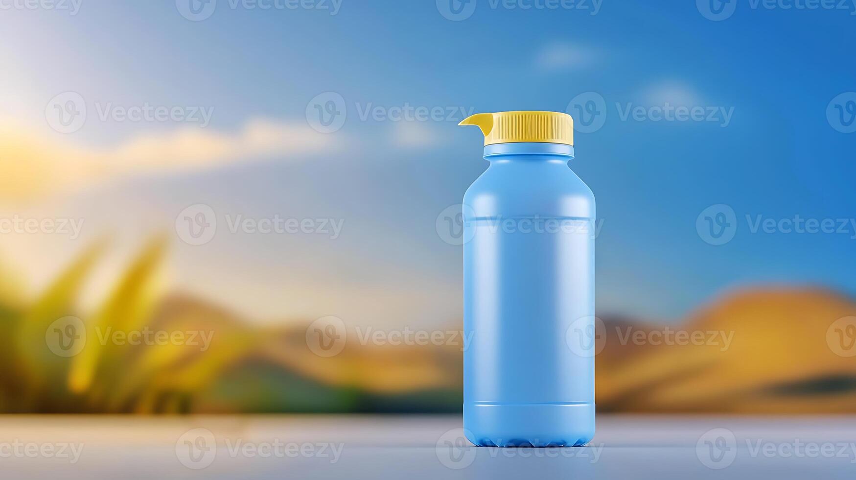 A vibrant blue plastic bottle with a yellow cap stands against a blurred natural landscape photo