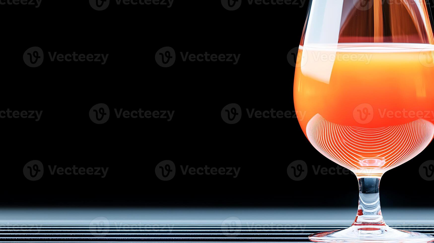 A vibrant orange cocktail in a glass on a black background, showcasing its reflection and texture photo