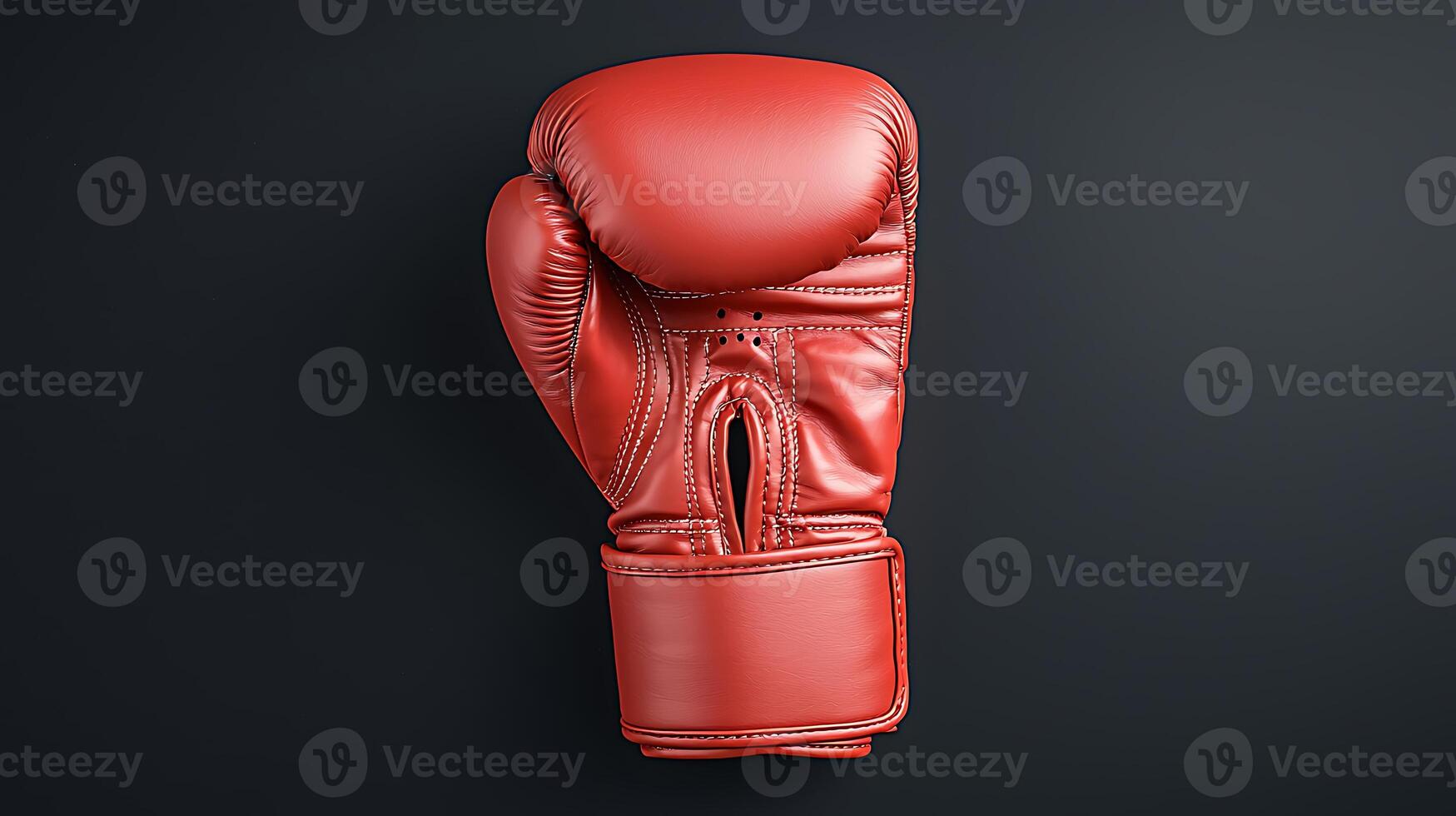 A vibrant red boxing glove displayed against a sleek black background, emphasizing its design and texture photo