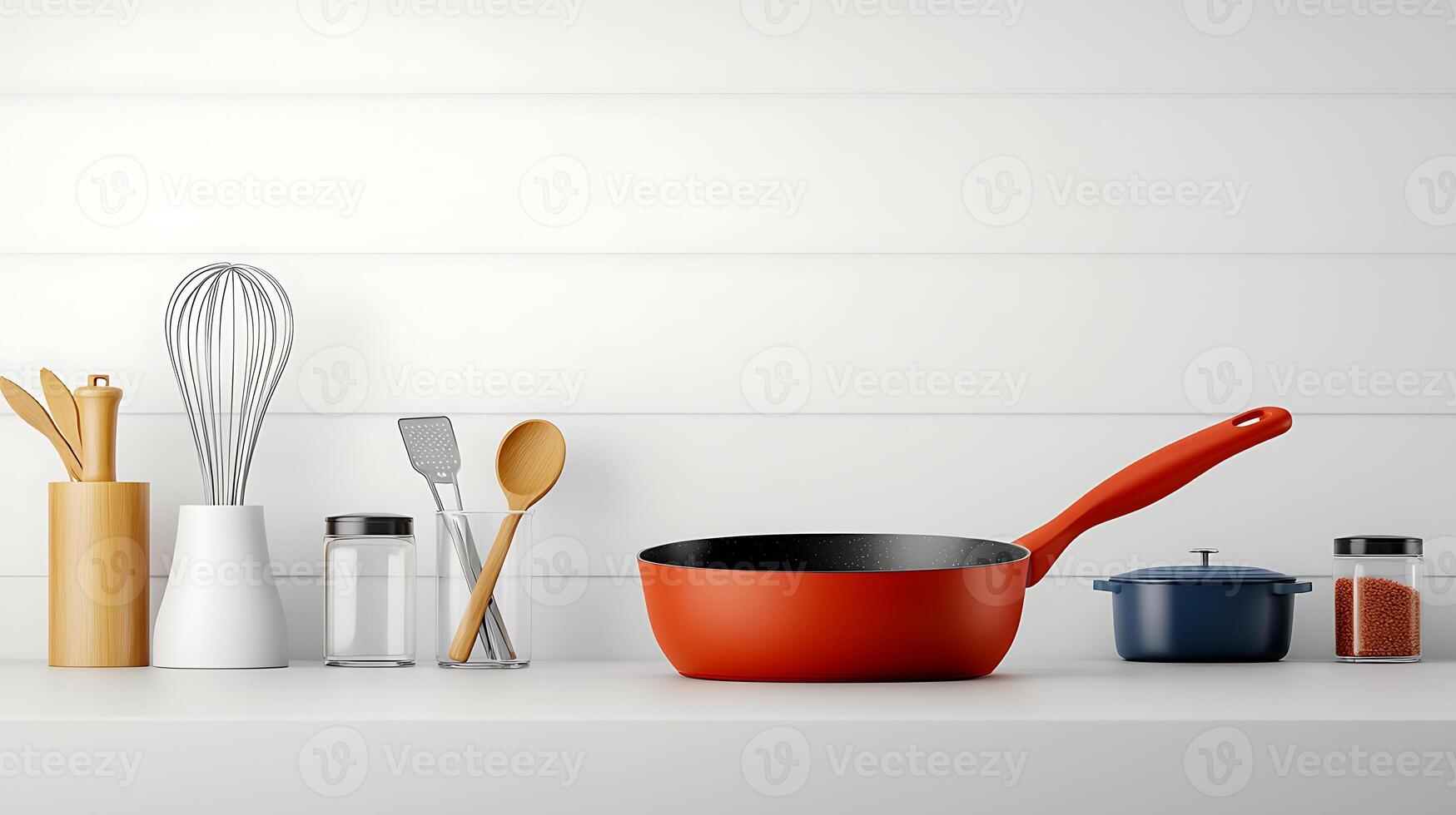 A vibrant red frying pan on a clean kitchen countertop with cooking utensils and spices photo