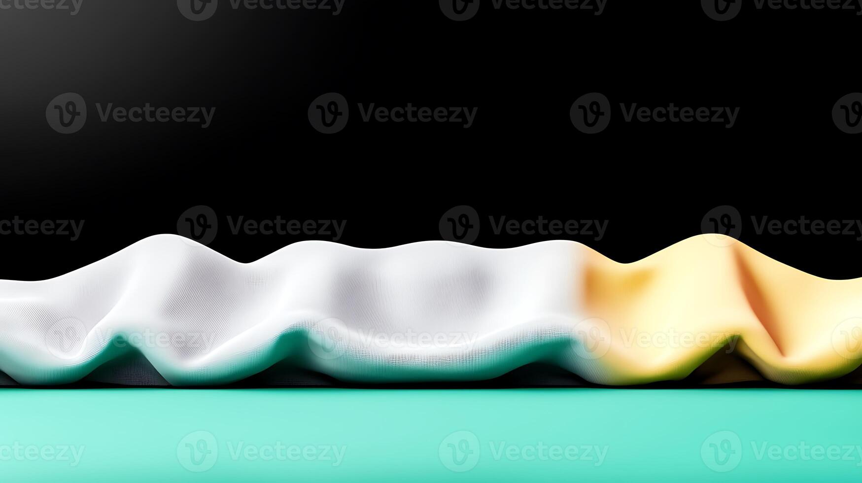 Abstract composition of draped fabric in white, yellow, and teal against a black background photo