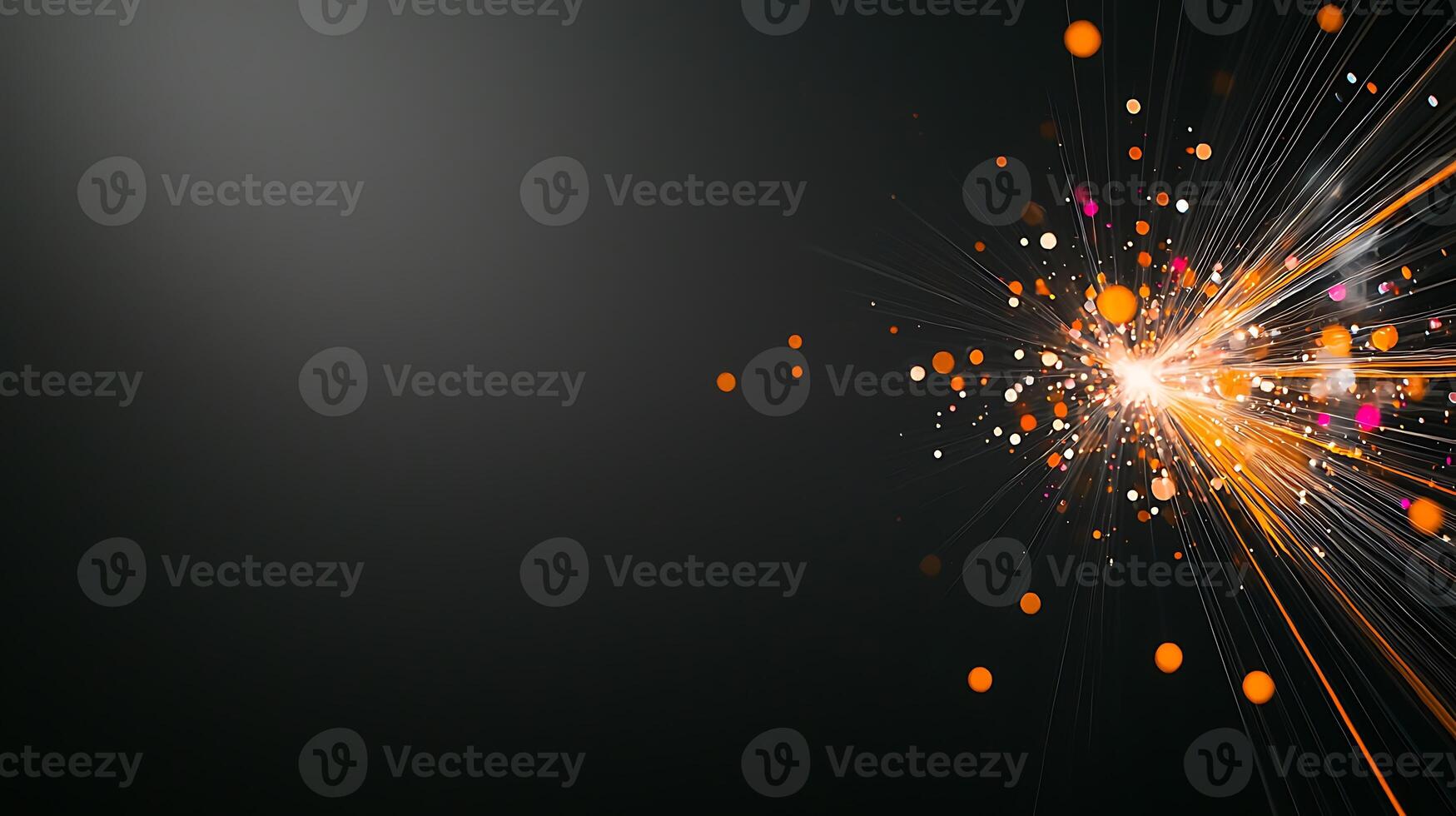 Abstract explosion of colorful light particles against a dark background, creating dynamic energy photo