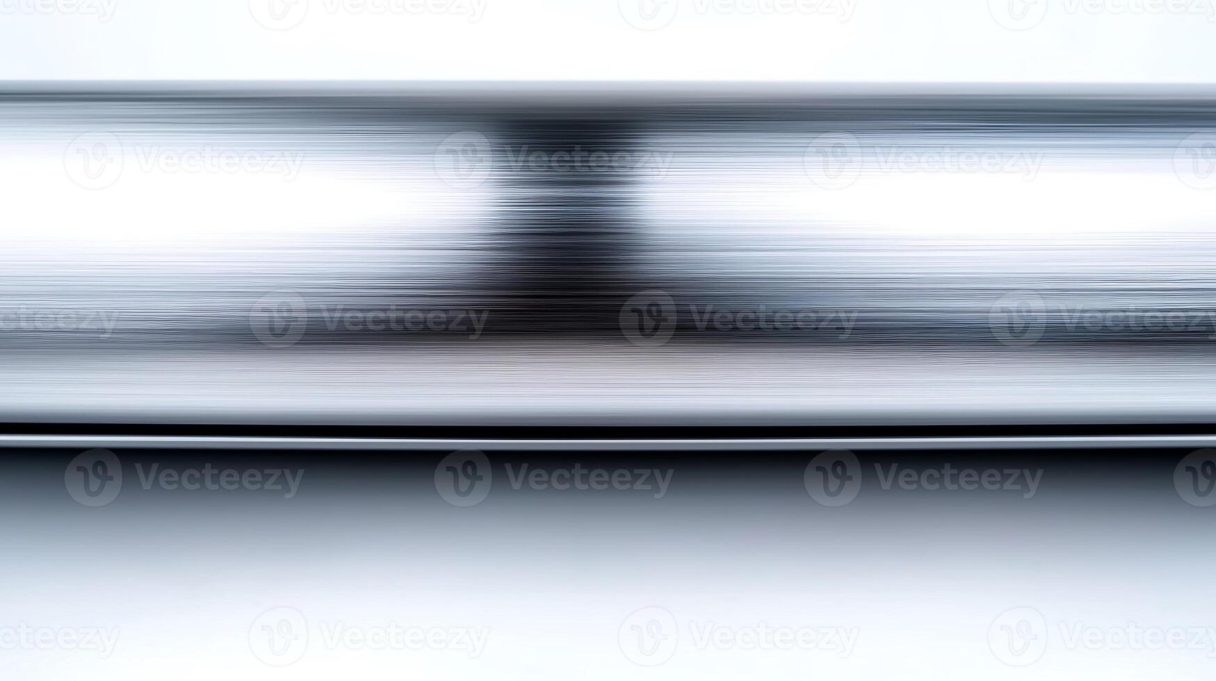 Abstract metallic surface with blurred reflections creating a sense of motion and depth photo