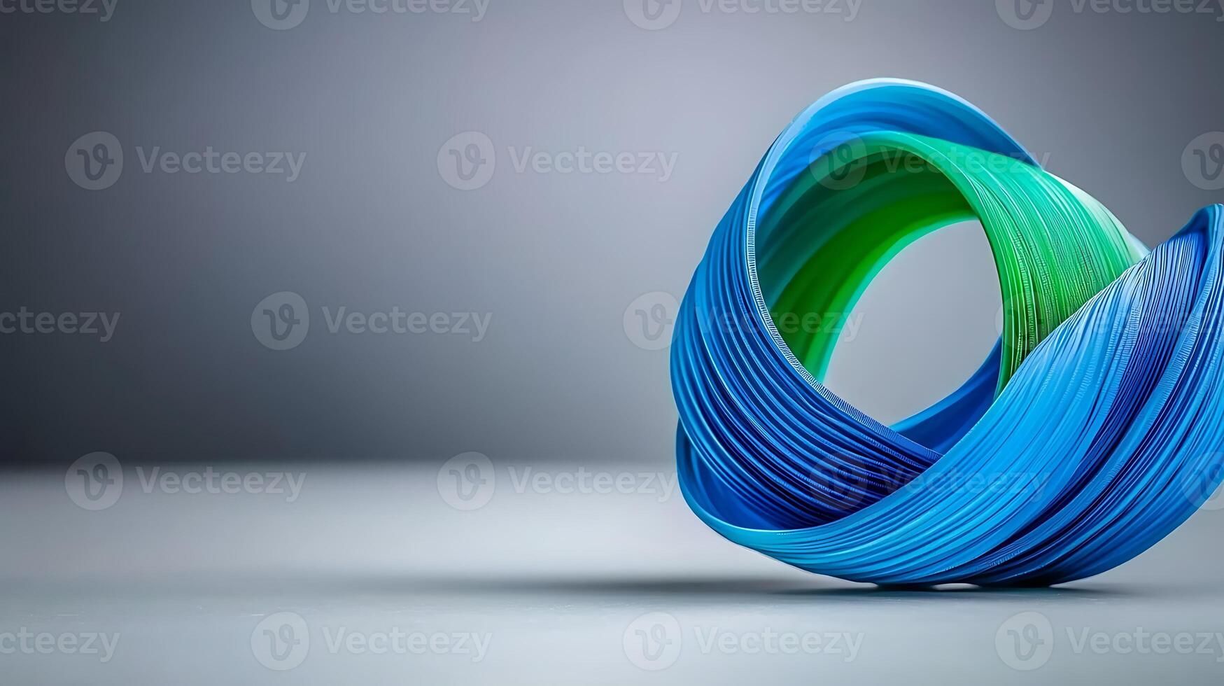 Abstract sculpture made of colorful twisted ribbons on a minimalist background photo