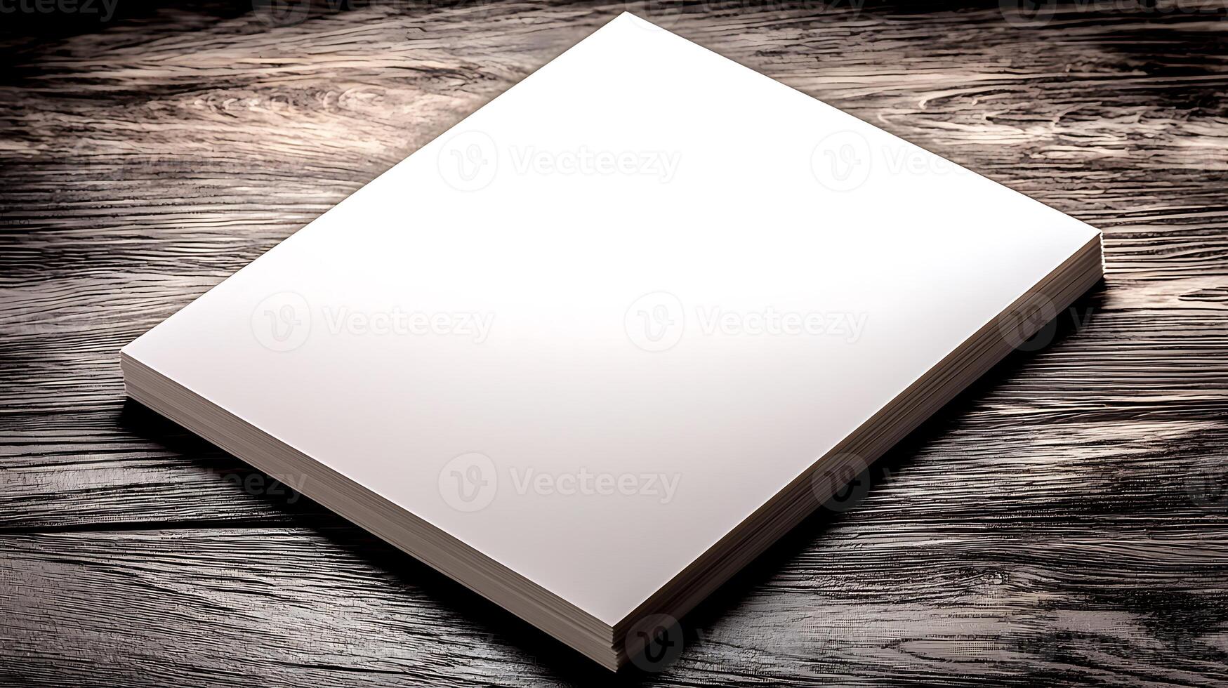 Blank white notebook resting on a wooden table, ideal for writing, sketching, or planning photo