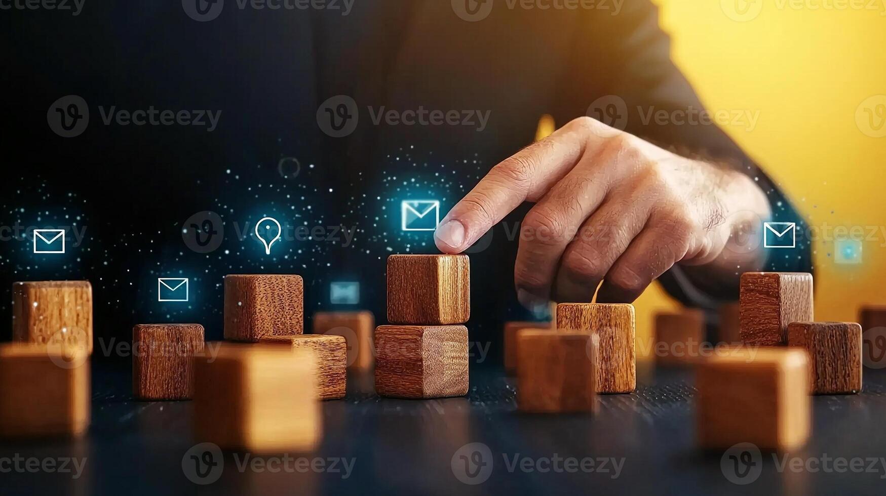 Businessman interacting with digital icons over wooden blocks, symbolizing communication and innovation photo