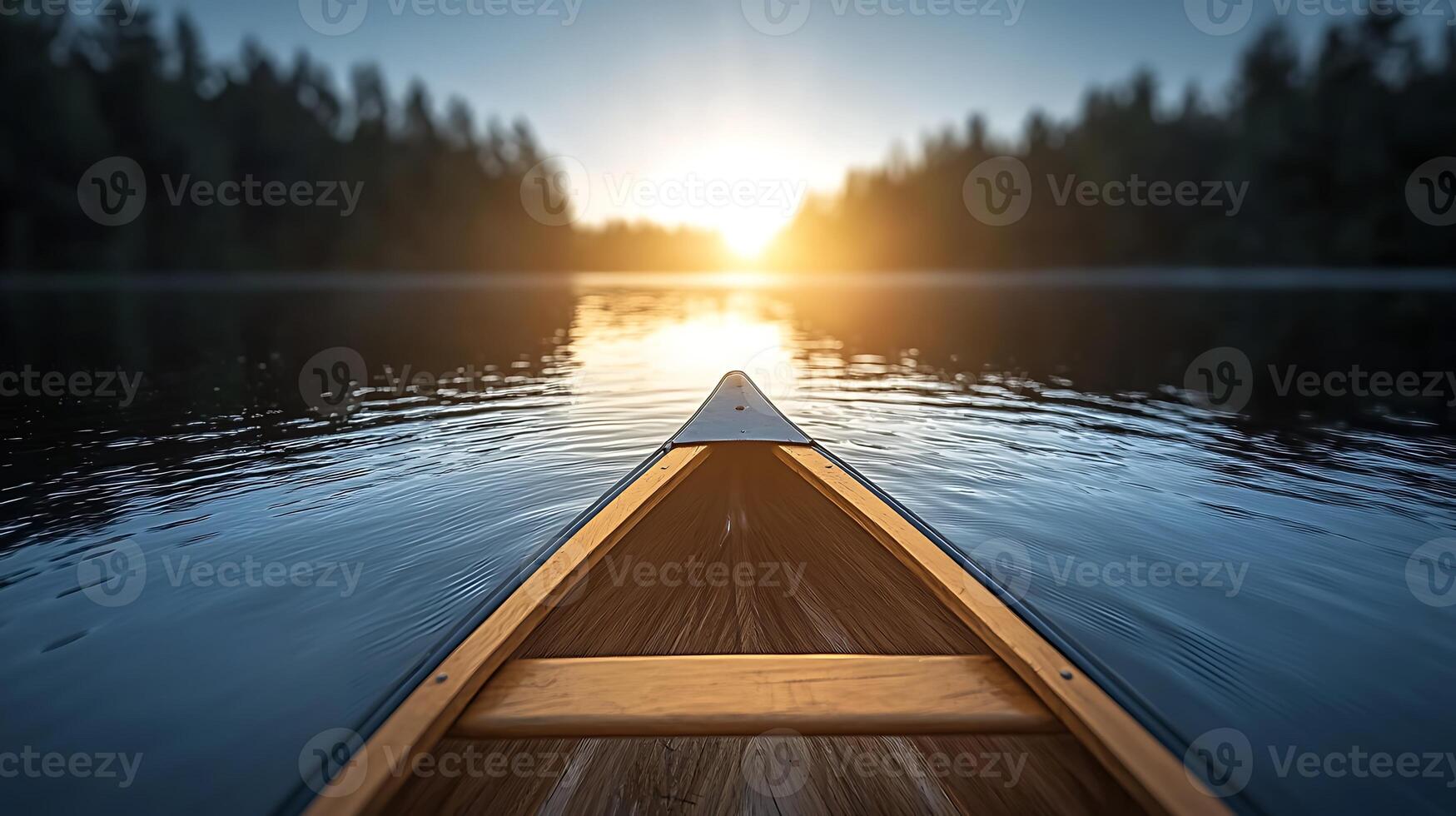 Canoe gliding through tranquil waters at sunset, surrounded by lush forest, creating serenity photo