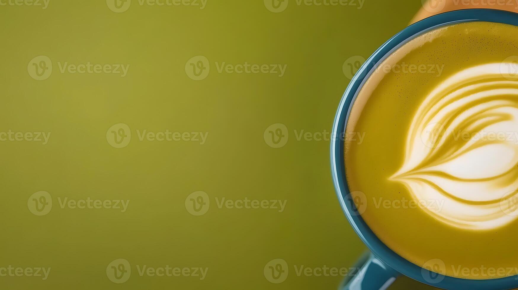 Close-up of a beautifully crafted latte art in a blue mug against a soft green background photo