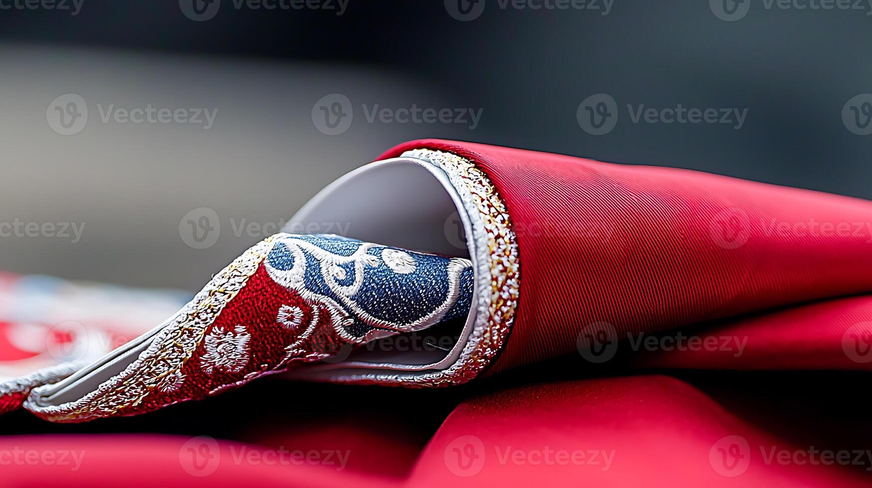 Close-up of a beautifully embroidered fabric with intricate patterns and vibrant colors photo