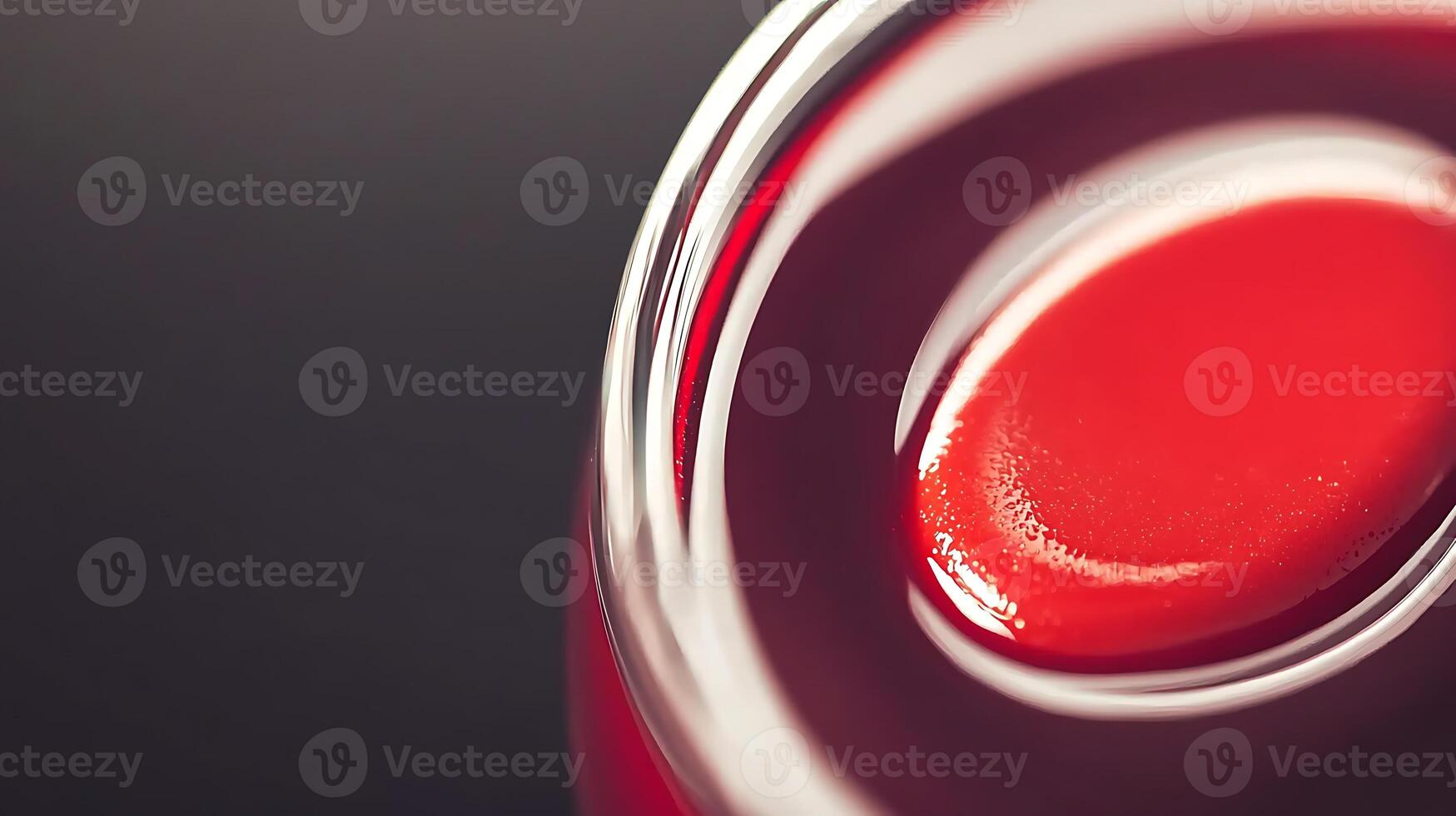 Close-up of a glossy red liquid in a glass with a smooth surface, highlighting its vibrant color photo