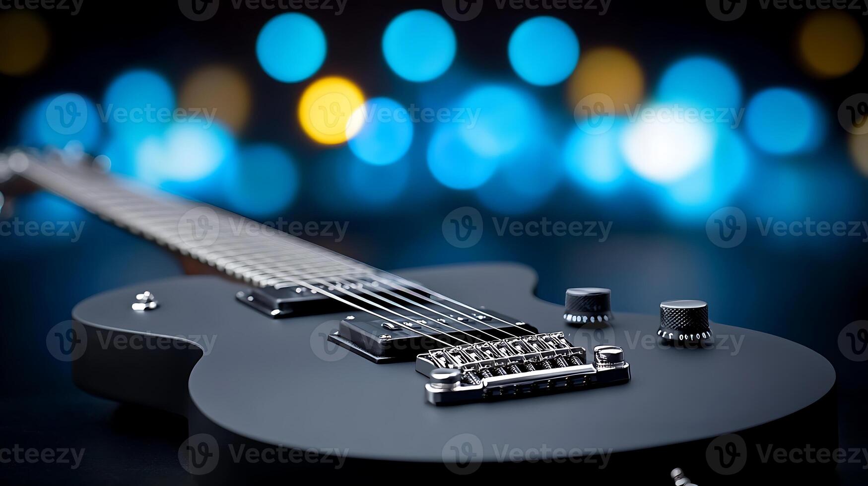 Close-up of a sleek electric guitar on a blurred background with colorful bokeh lights photo