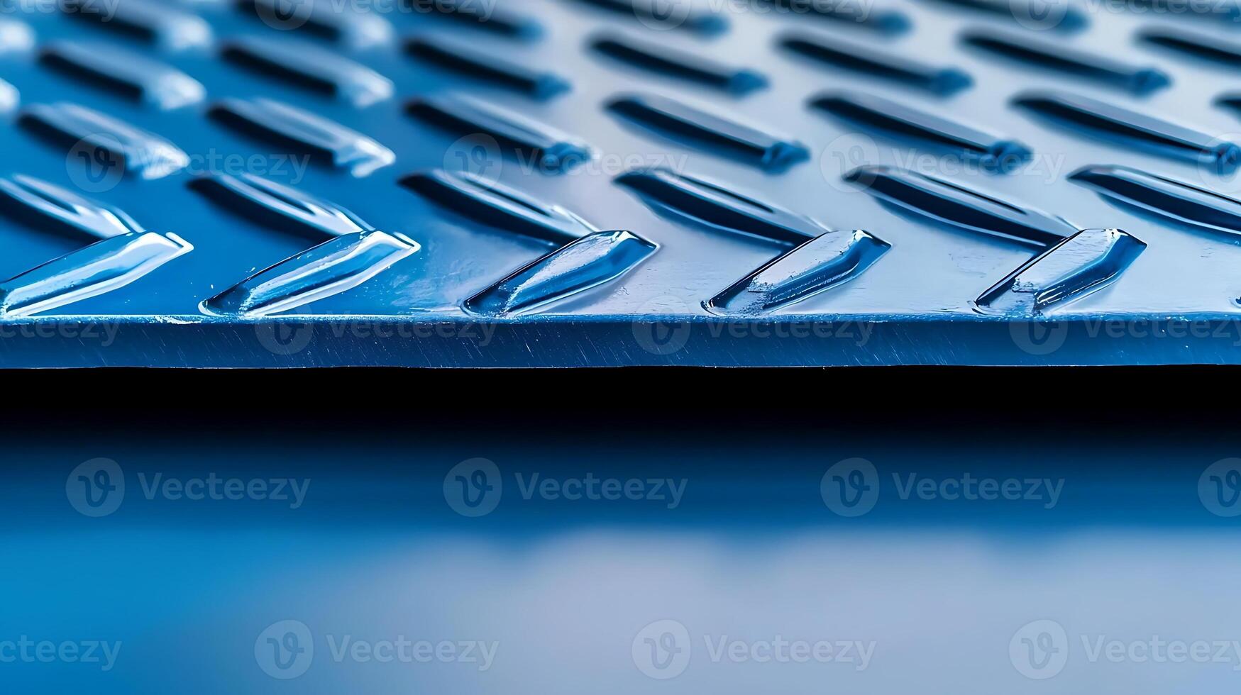 Close-up of a textured blue metal surface with a diamond pattern, emphasizing industrial design photo