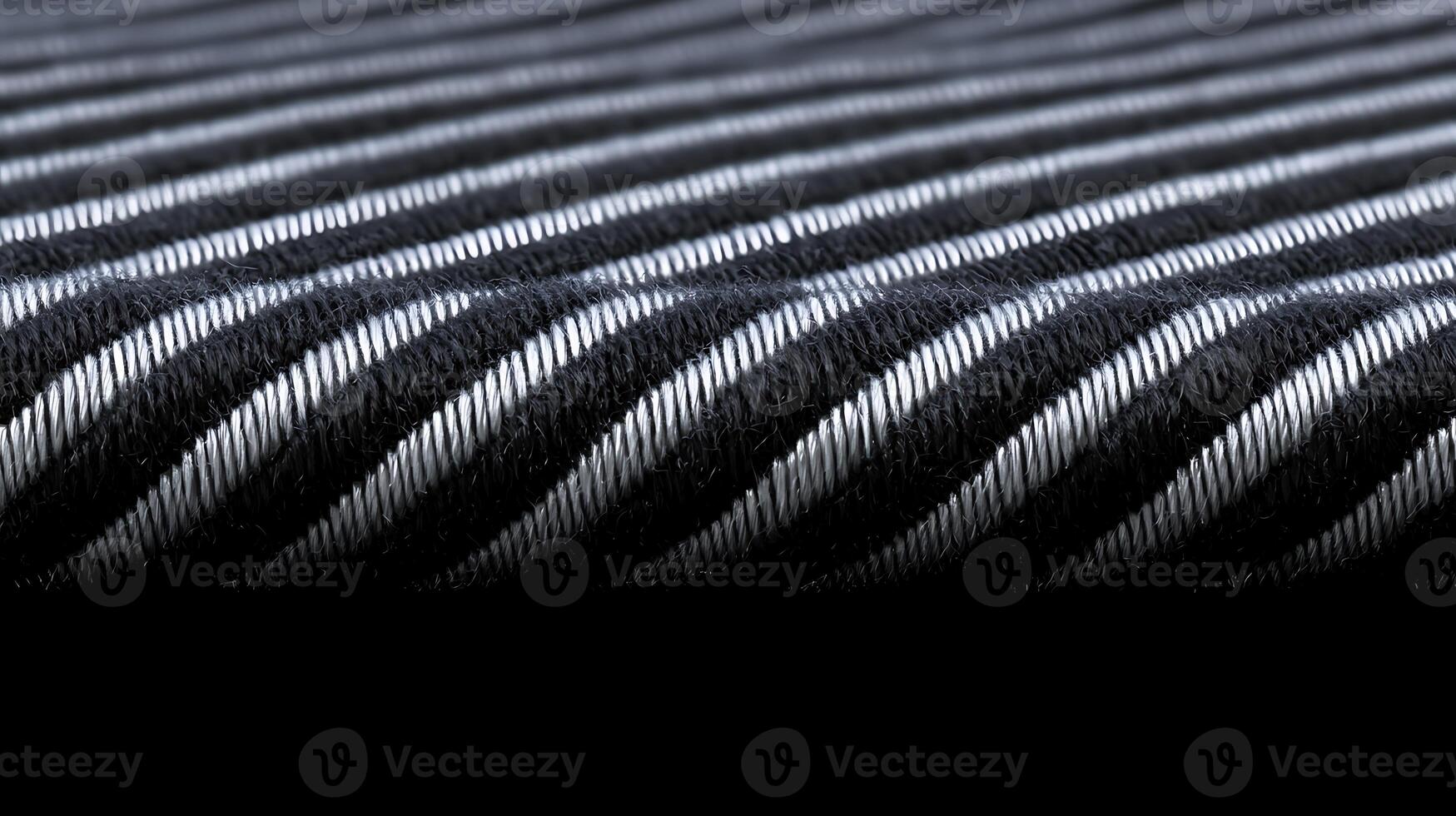 Close-up of a textured fabric with alternating black and white stripes, emphasizing its weave photo