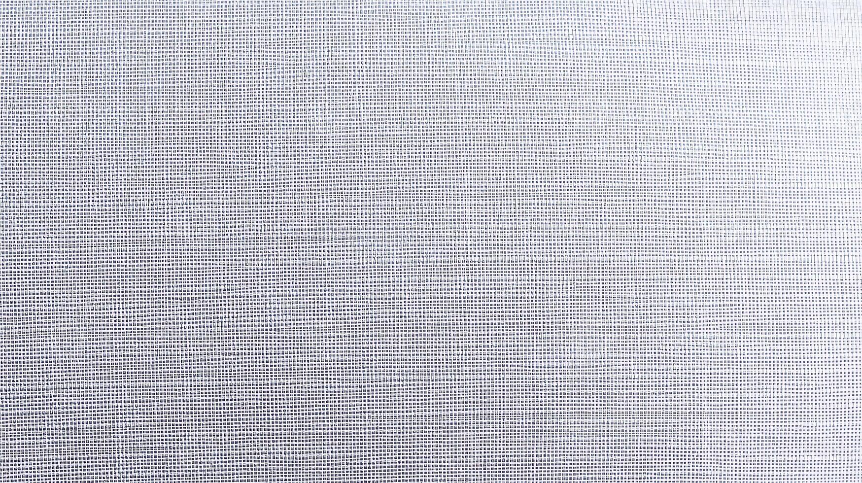 Close-up of a textured light gray fabric with subtle woven patterns, ideal for design projects photo