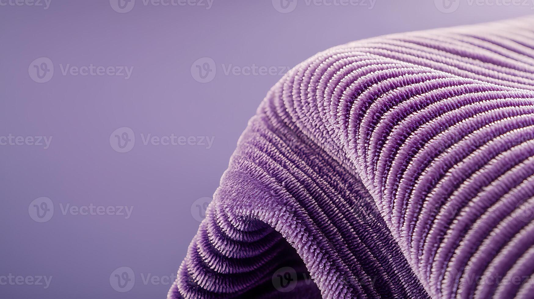 Close-up of a textured purple fabric draping elegantly, showcasing its unique pattern and softness photo