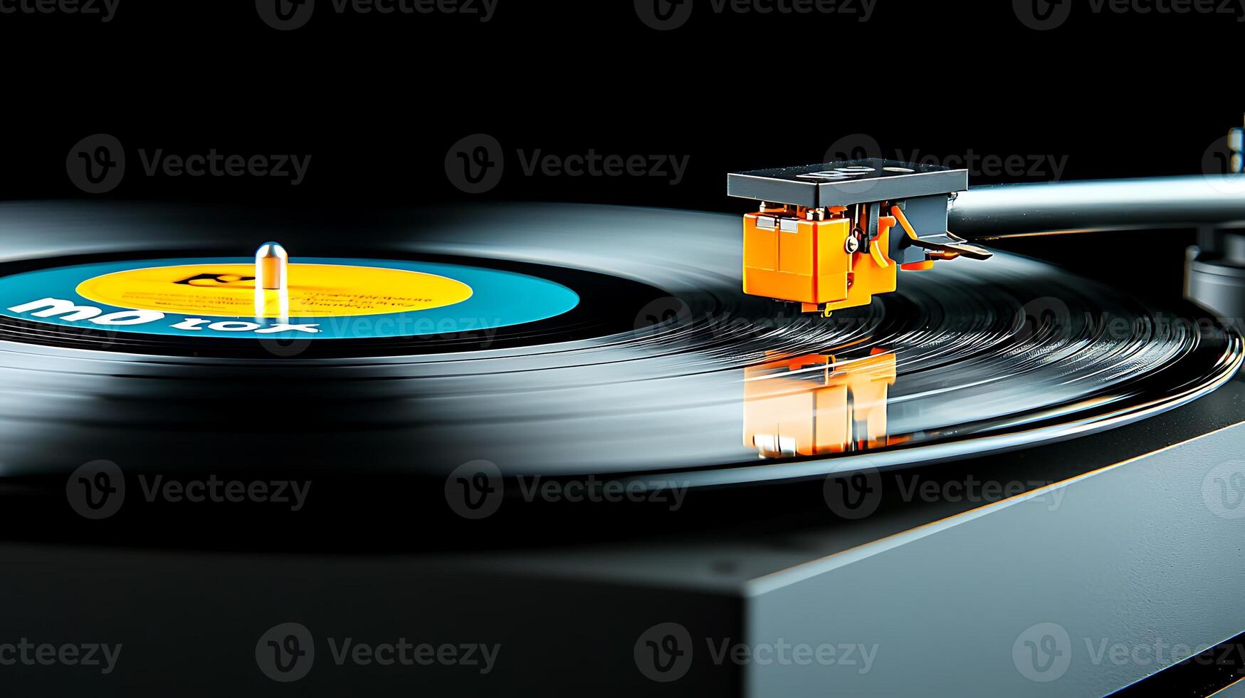 Close-up of a vinyl record spinning on a turntable with vibrant label and reflections photo