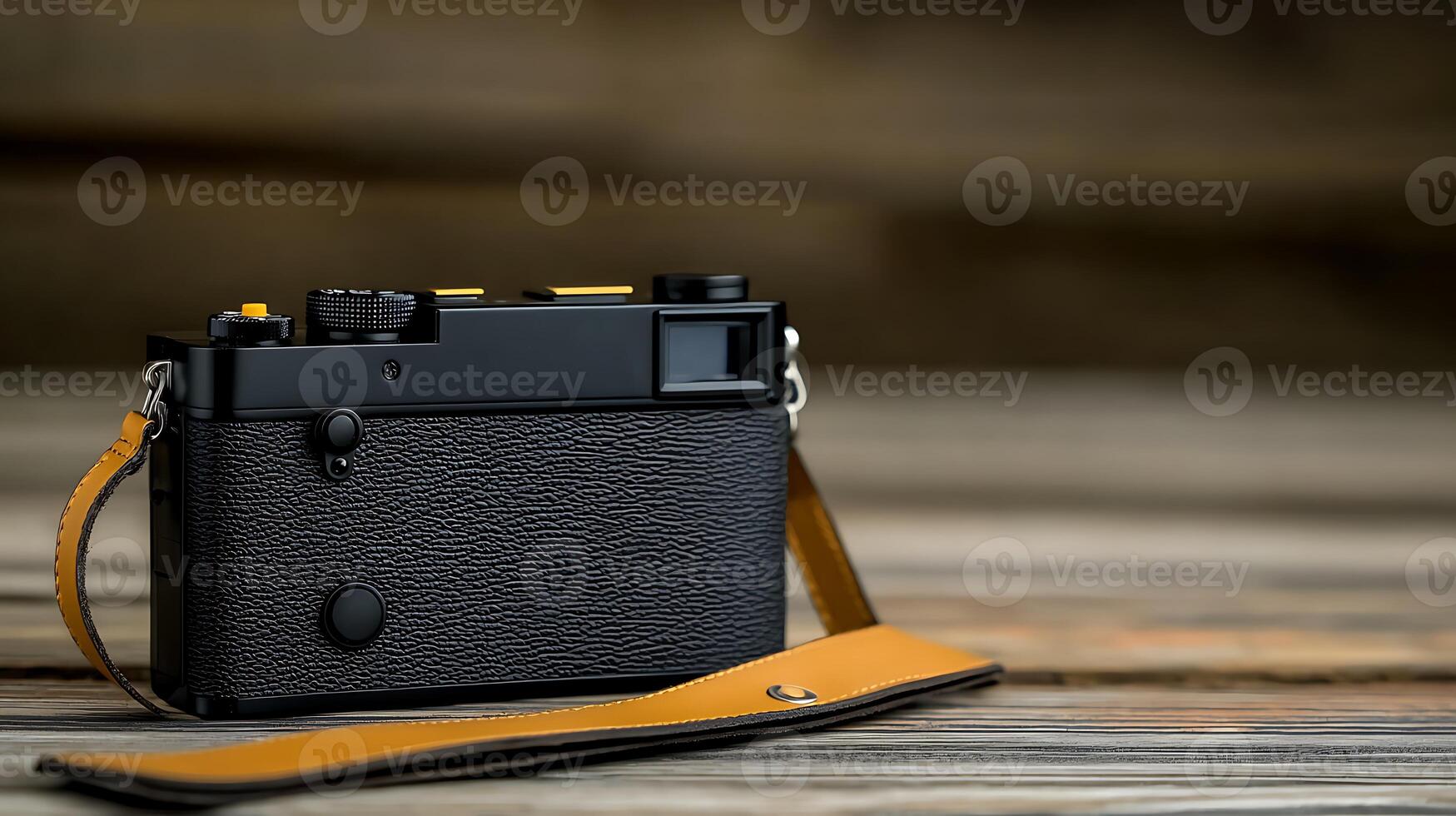 Close-up of a vintage camera on a wooden surface with a blurred background, showcasing craftsmanship photo