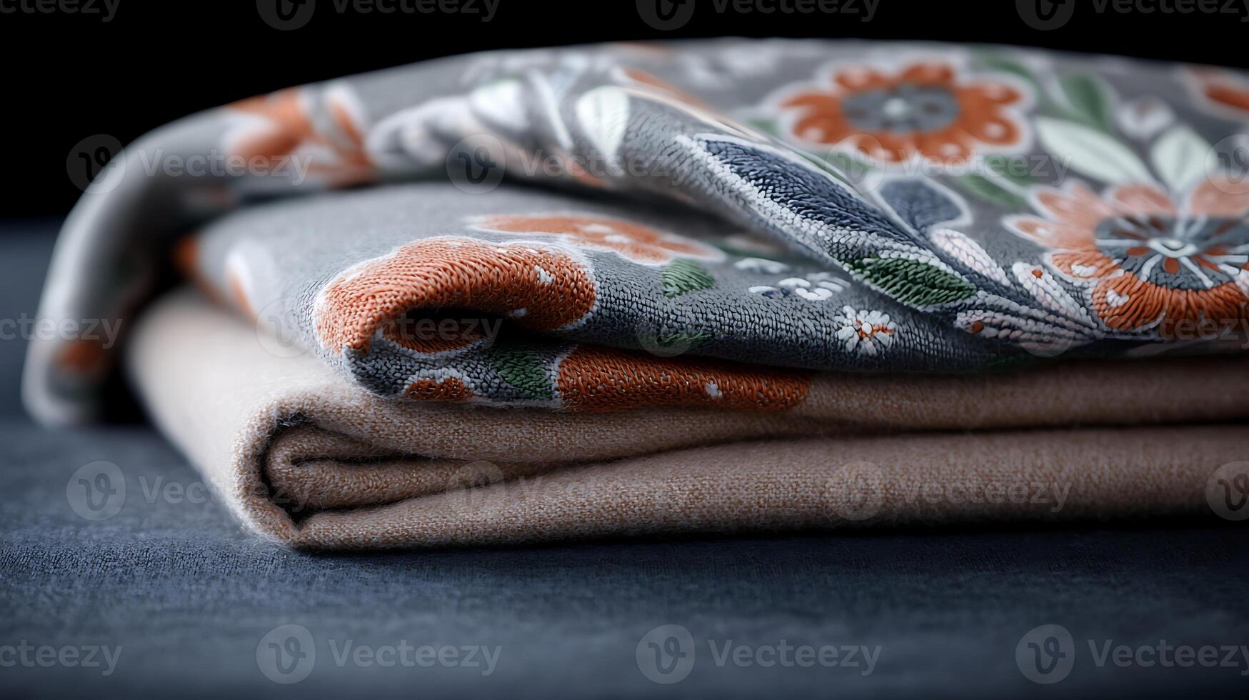 Close-up of elegantly folded decorative fabric showcasing intricate floral patterns and textures photo