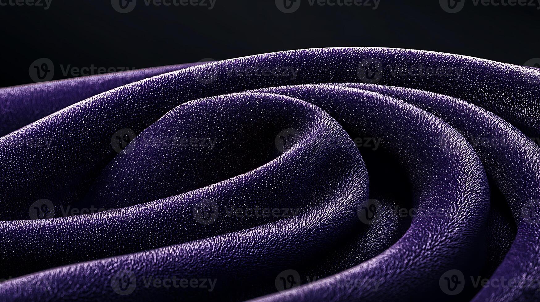Close-up of elegant purple fabric with intricate folds and textures, creating a luxurious ambiance photo