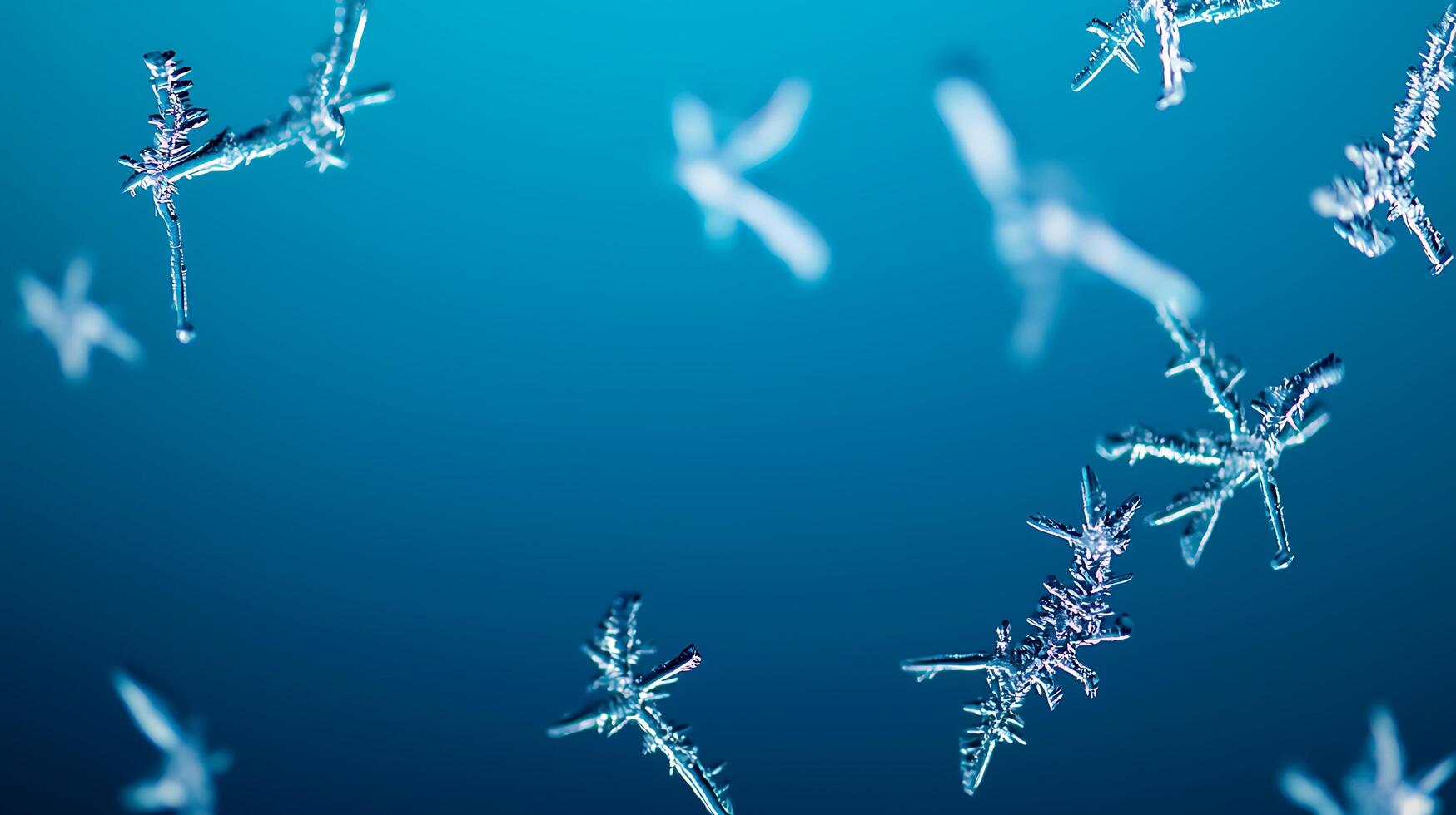 Close-up view of delicate snowflakes floating against a soft blue background, showcasing winter beauty photo
