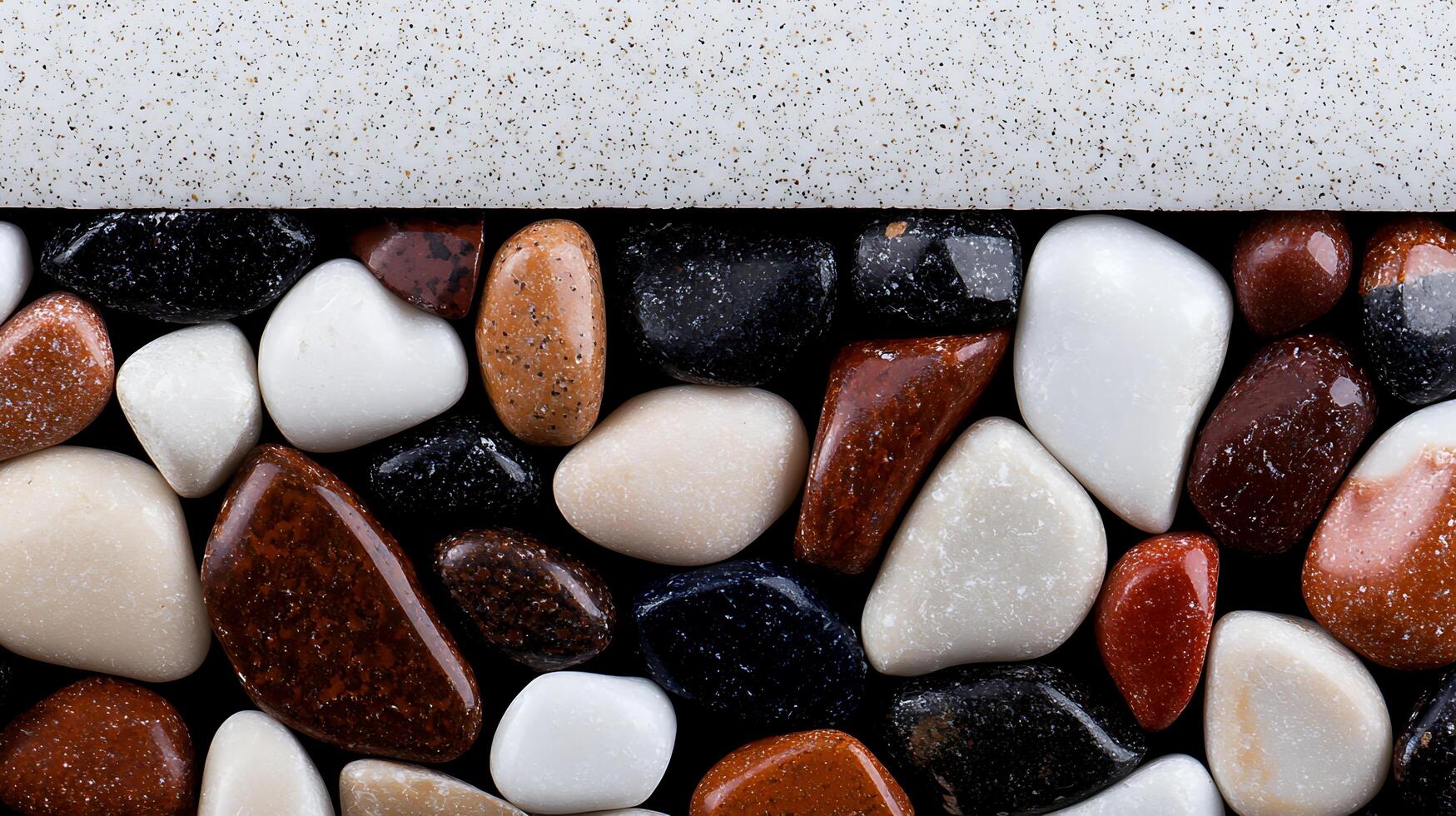 Close-up view of colorful pebbles arranged neatly along a smooth surface, showcasing texture and color photo