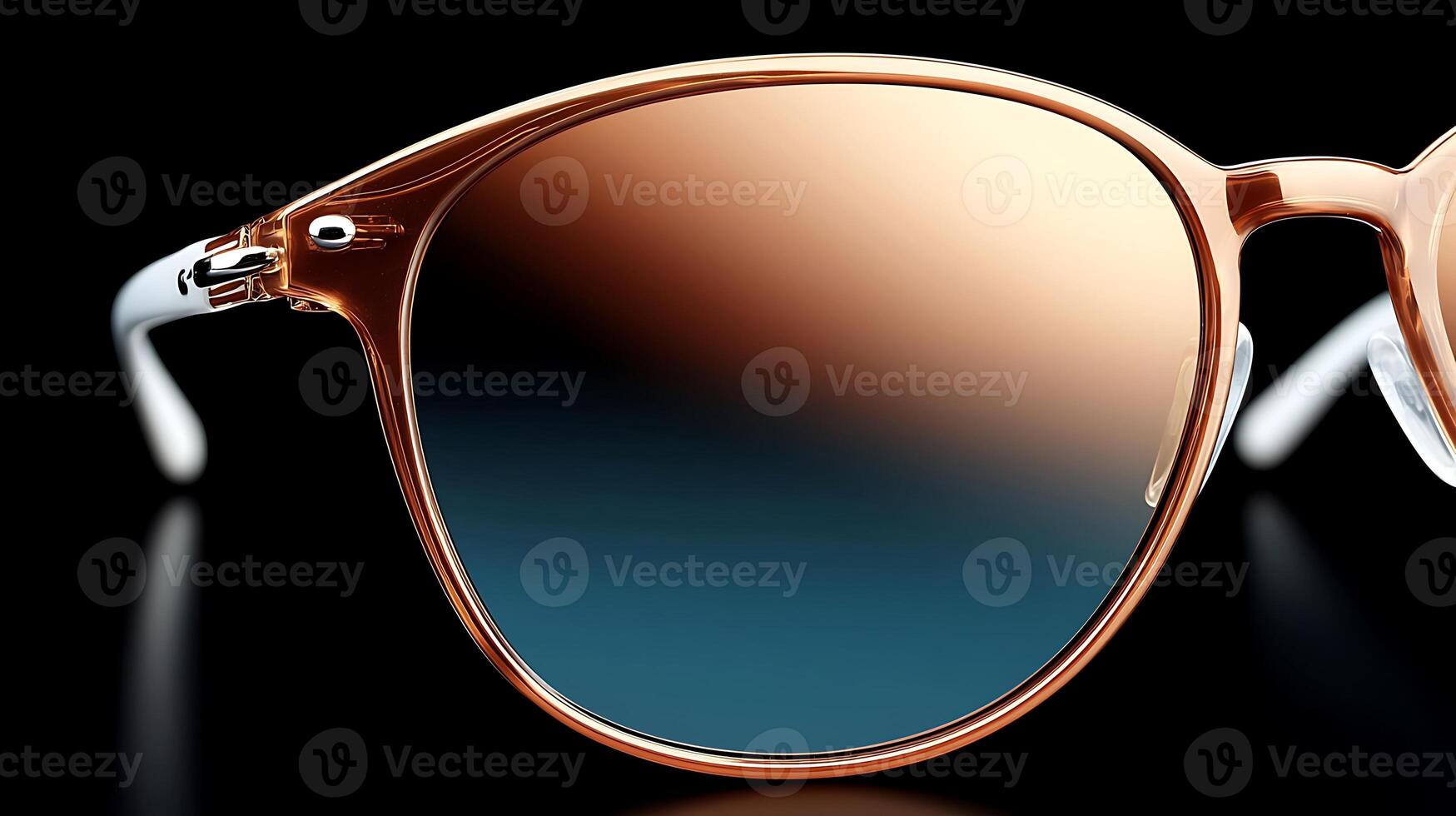 Close-up view of stylish sunglasses with gradient lenses against a dark background photo