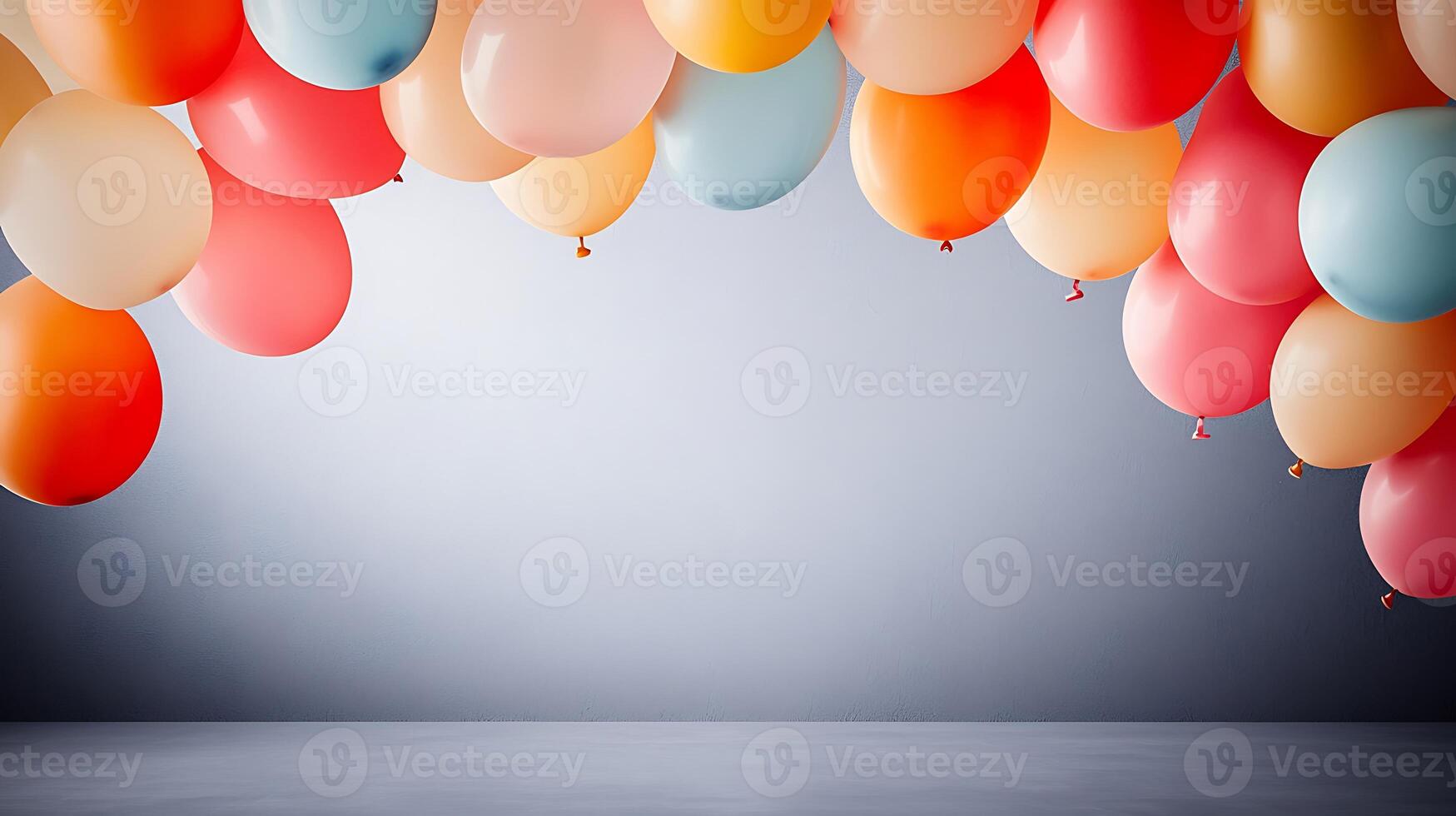 Colorful balloons hanging against a soft gray background, creating a festive atmosphere photo