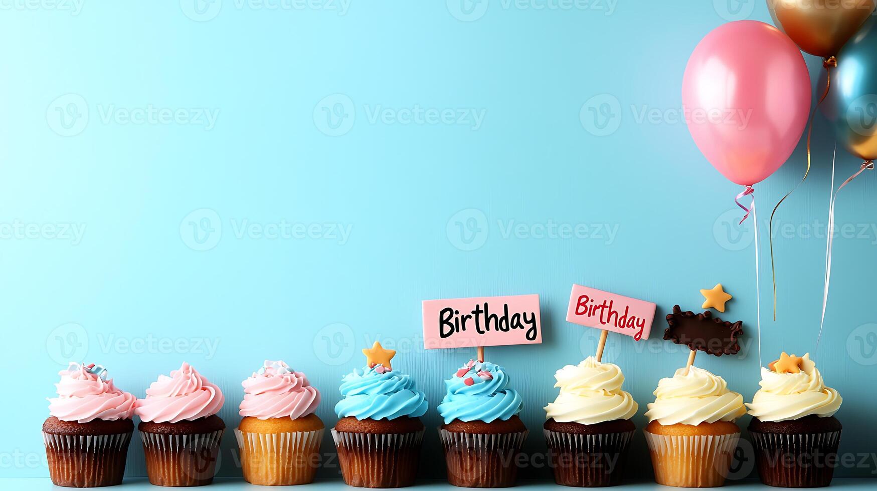 Colorful birthday cupcakes with decorative toppers and balloons against a blue background photo